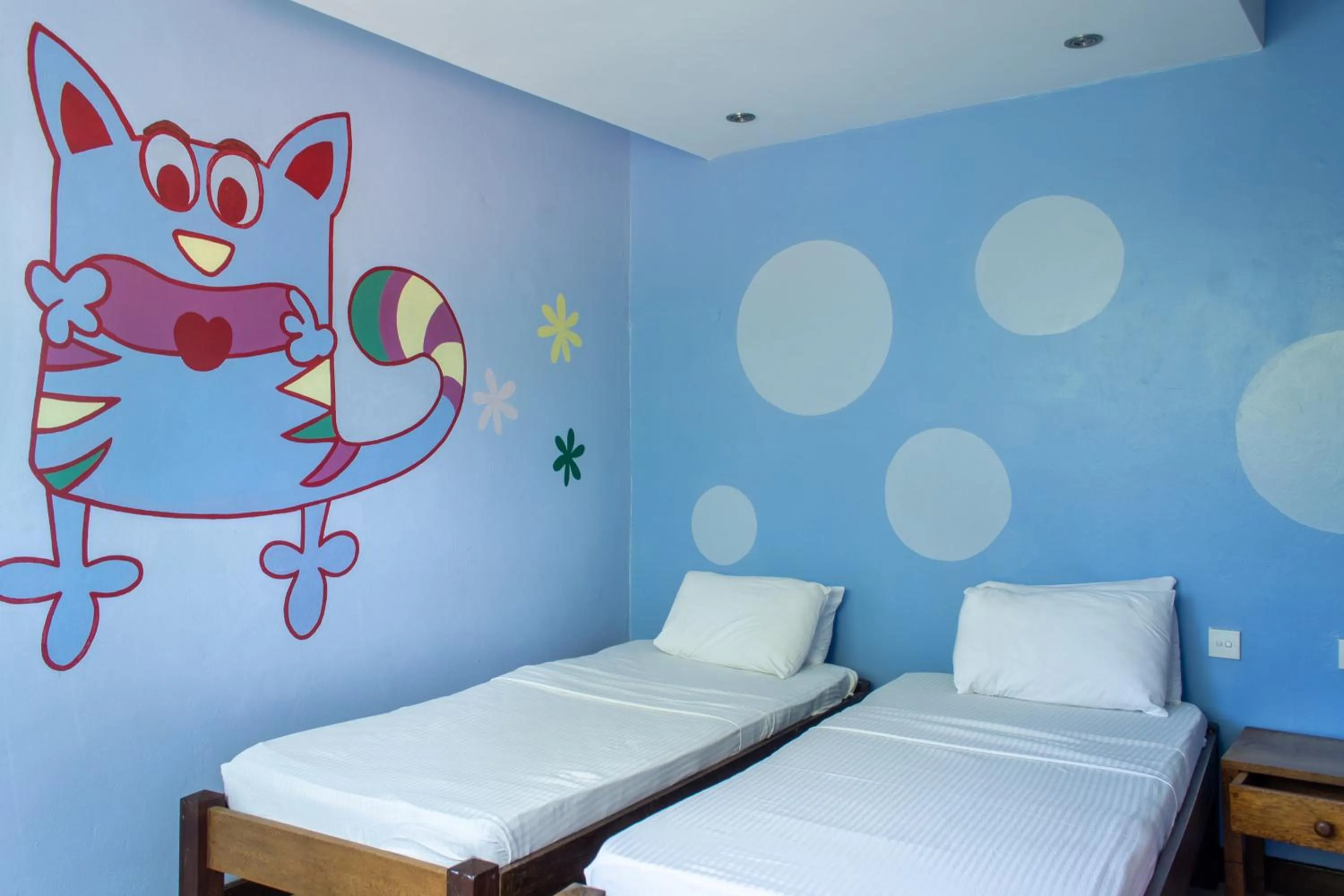 Bed in Cowrie Shell Beach Apartments Official