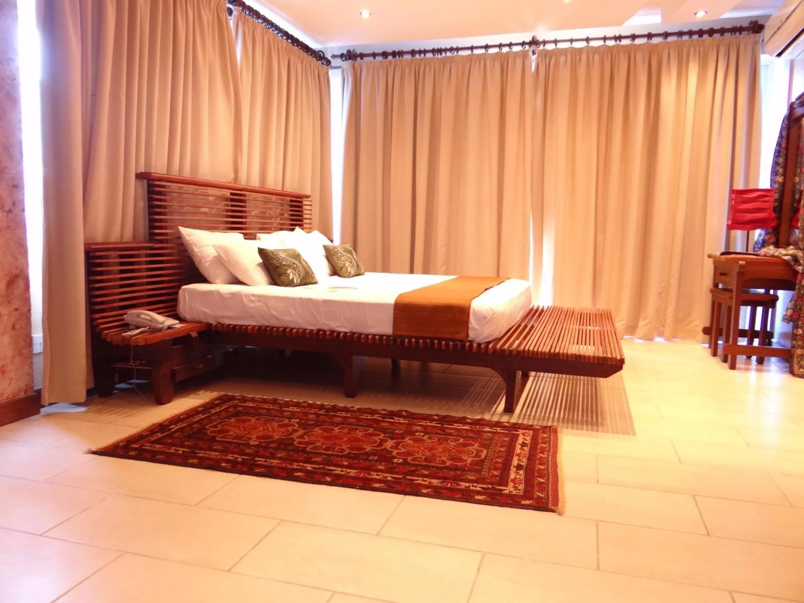 Bedroom, Bed in Cowrie Shell Beach Apartments Official