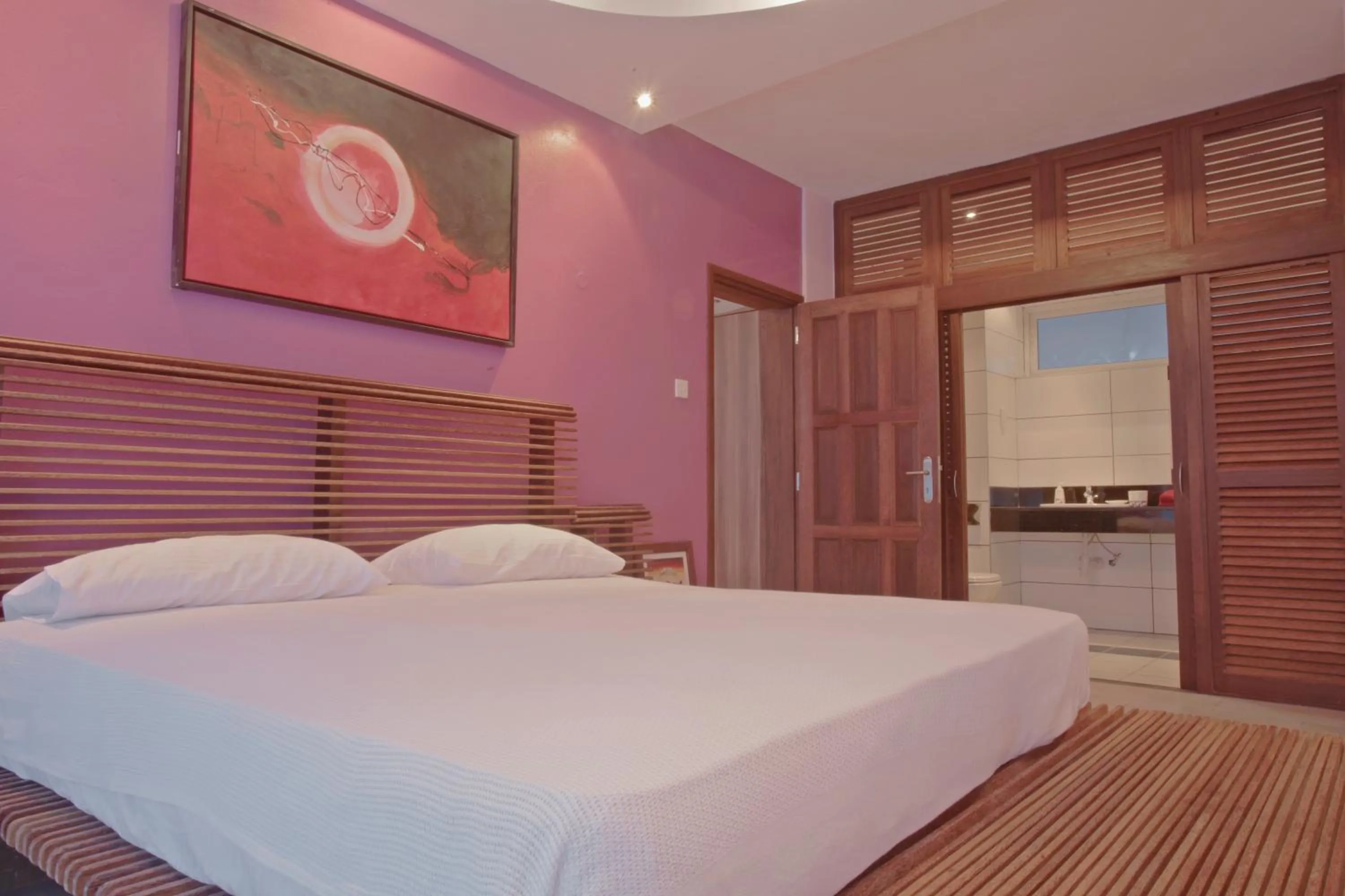 Bedroom, Bed in Cowrie Shell Beach Apartments Official