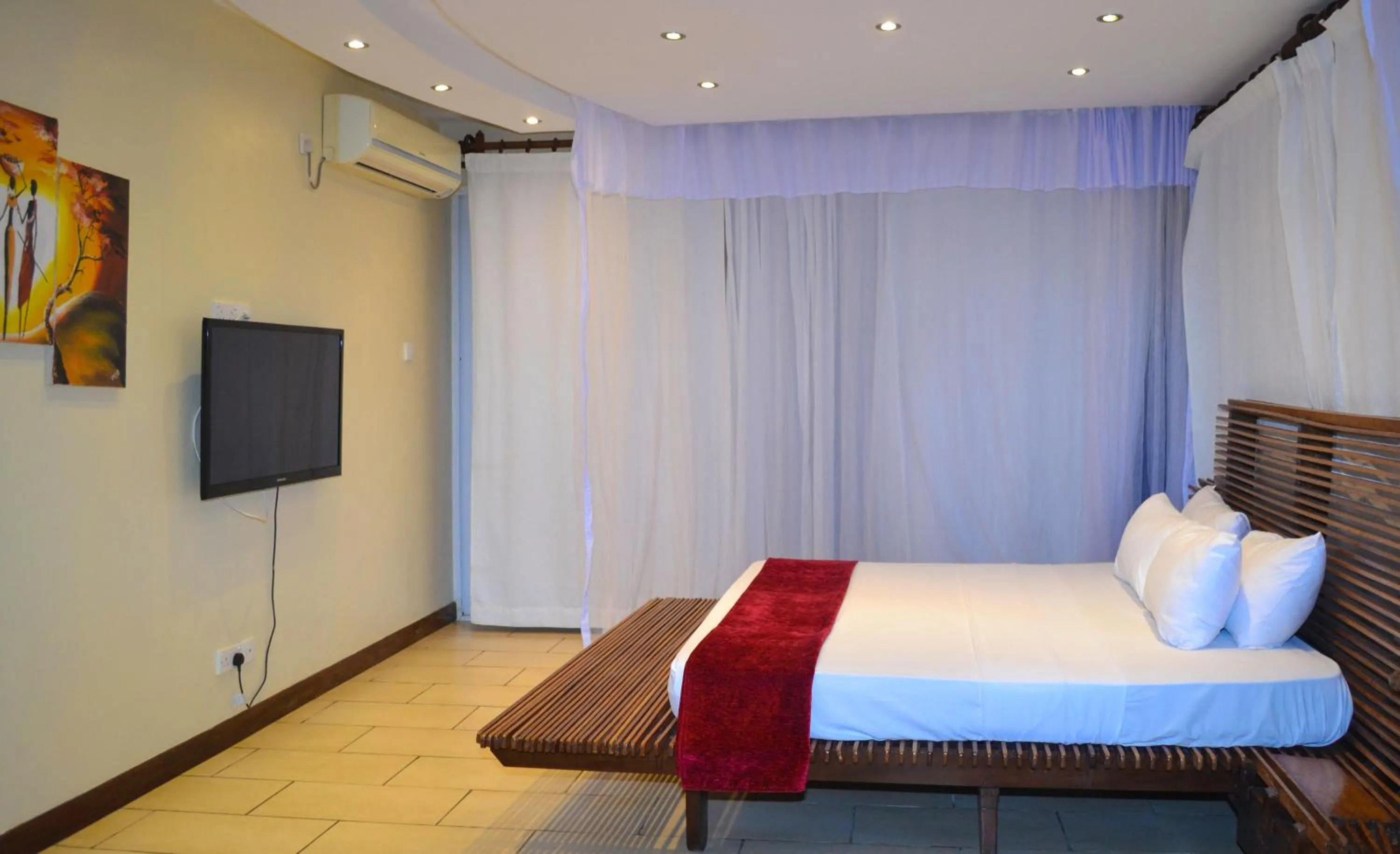 Bedroom, Bed in Cowrie Shell Beach Apartments Official