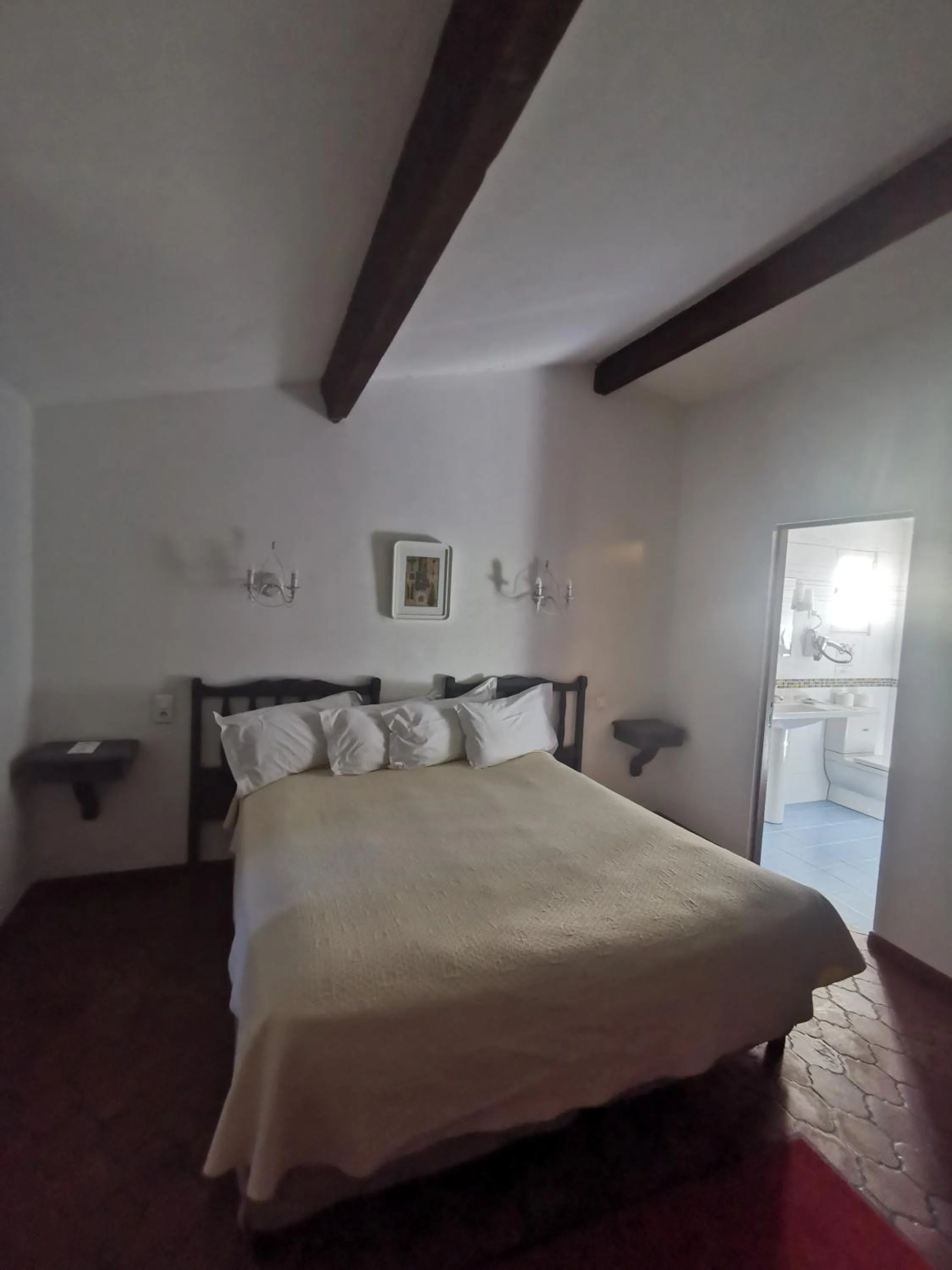 Bedroom in Hôtel Saint Andre