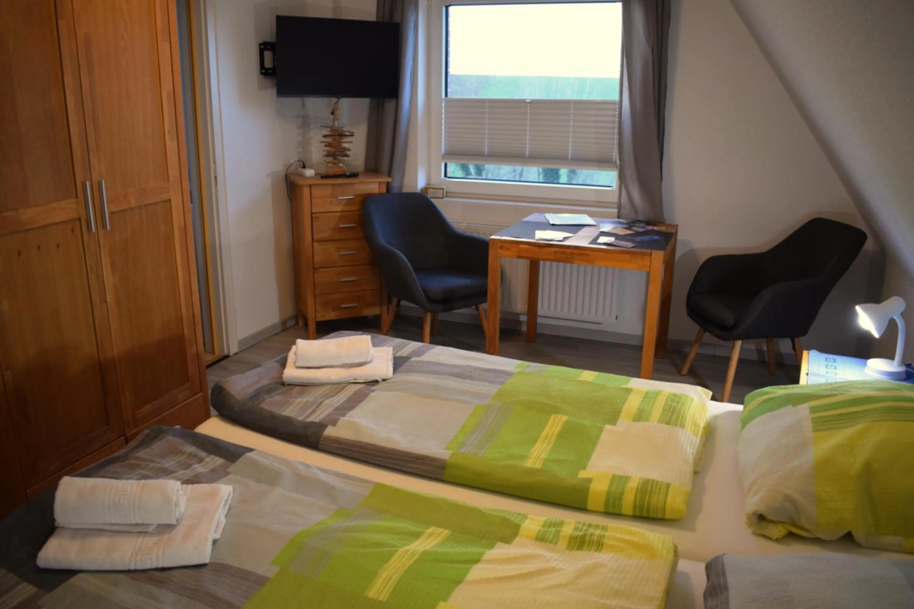 Living room, Bed in Hotel Haus am Meer