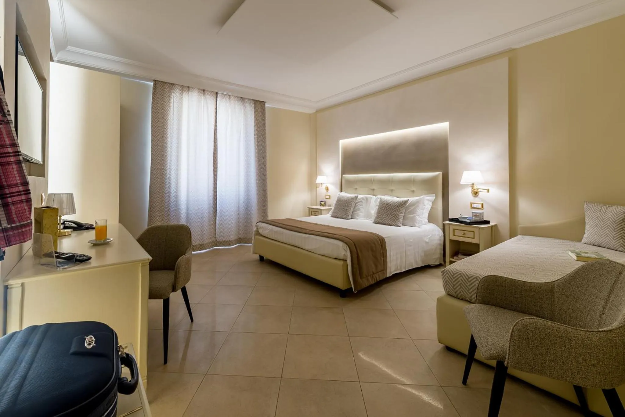 Seating area, Bed in Vittorio Emanuele Boutique Hotel