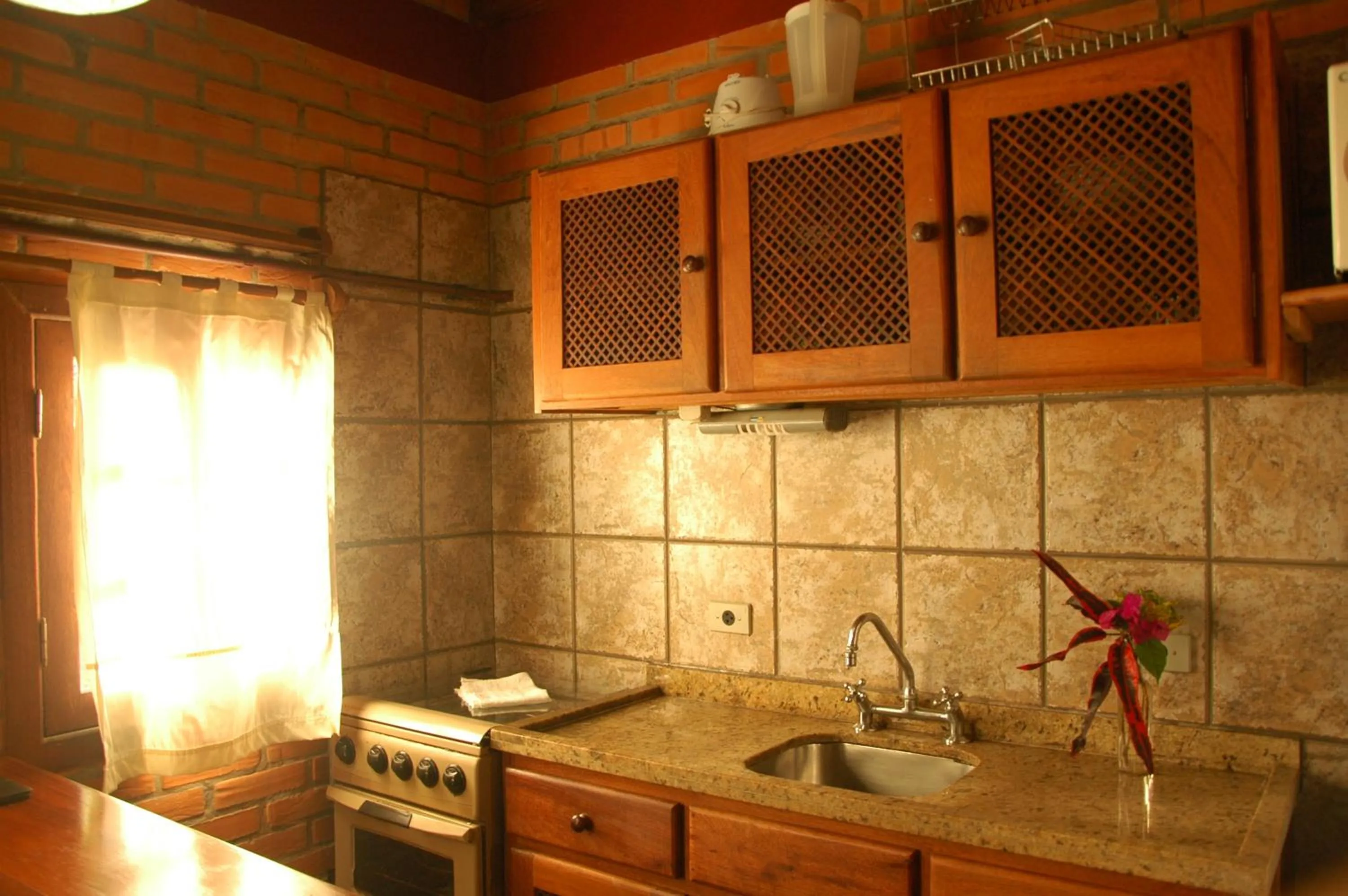 Kitchen or kitchenette in Pousada Além do Jardim
