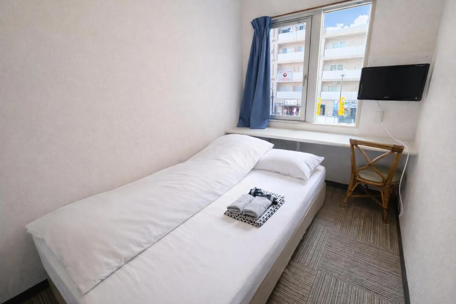 Bed in Sakura Hotel Jimbocho