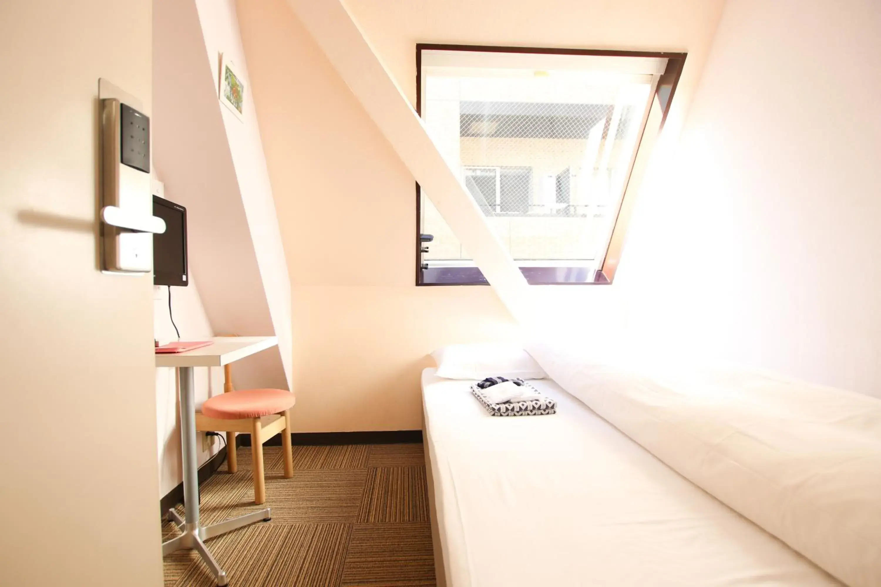 Bed in Sakura Hotel Jimbocho Bed in Sakura Hotel Jimbocho