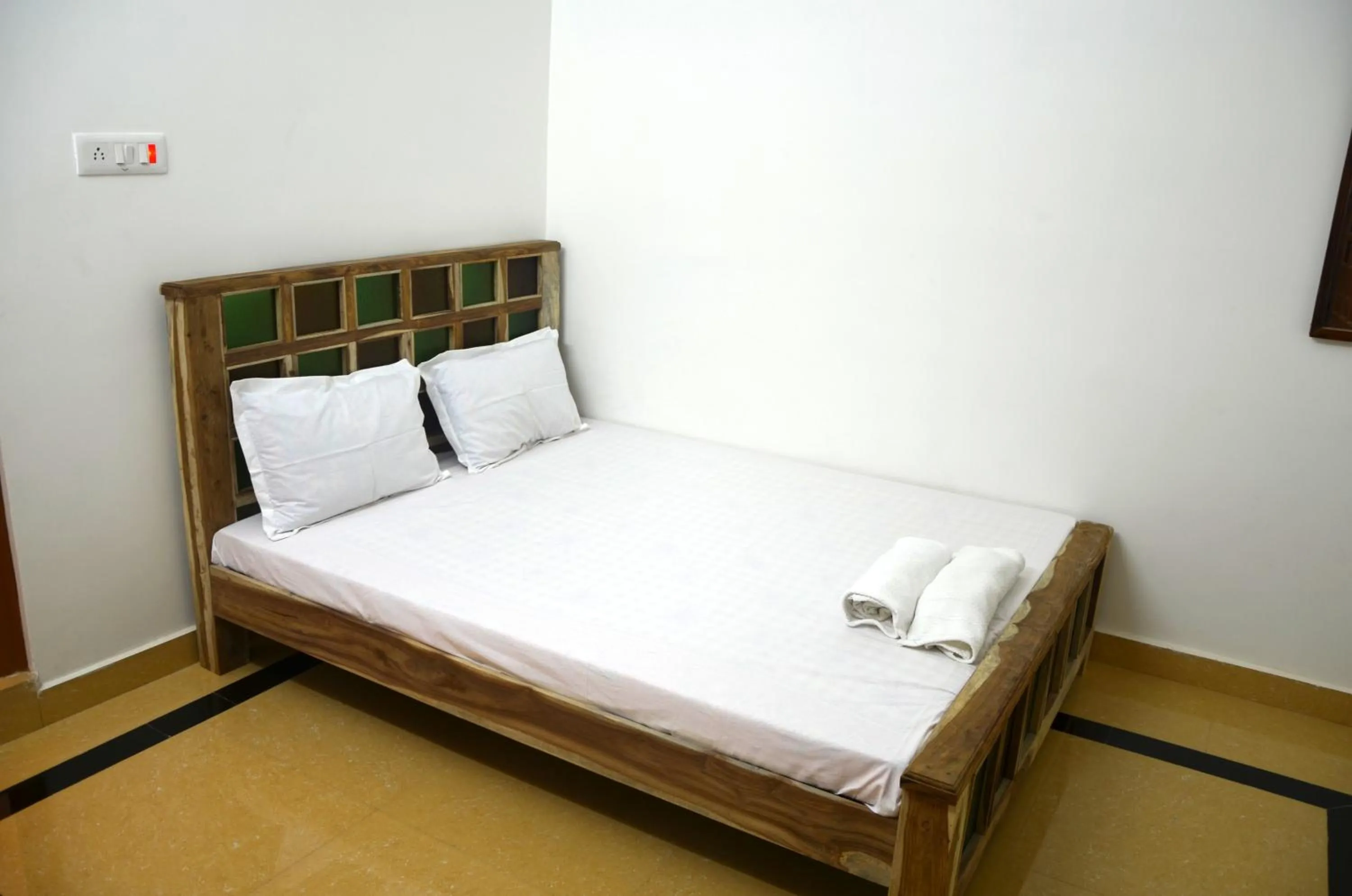 Bed in Gajanand Guest House