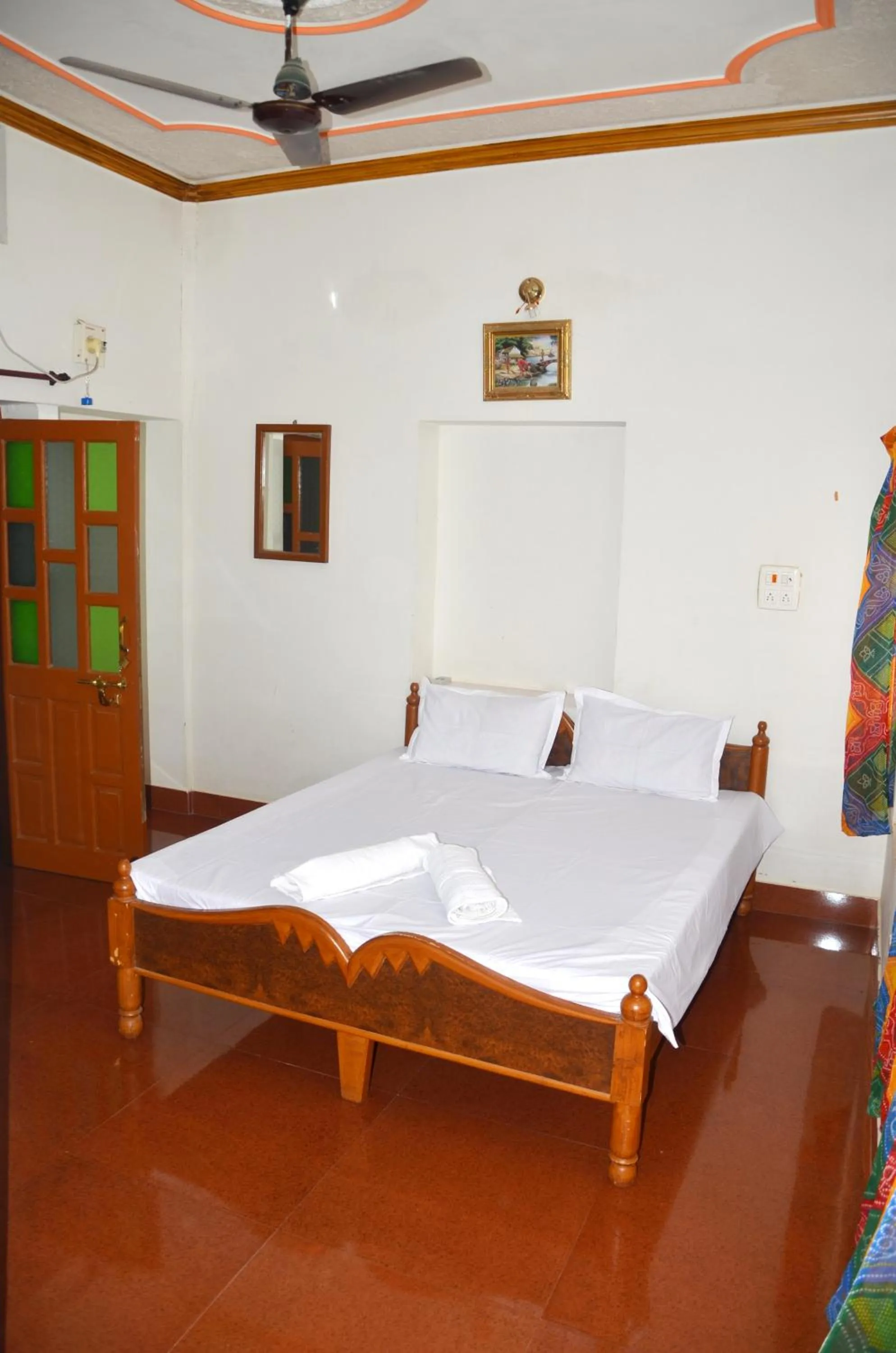 Bed in Gajanand Guest House