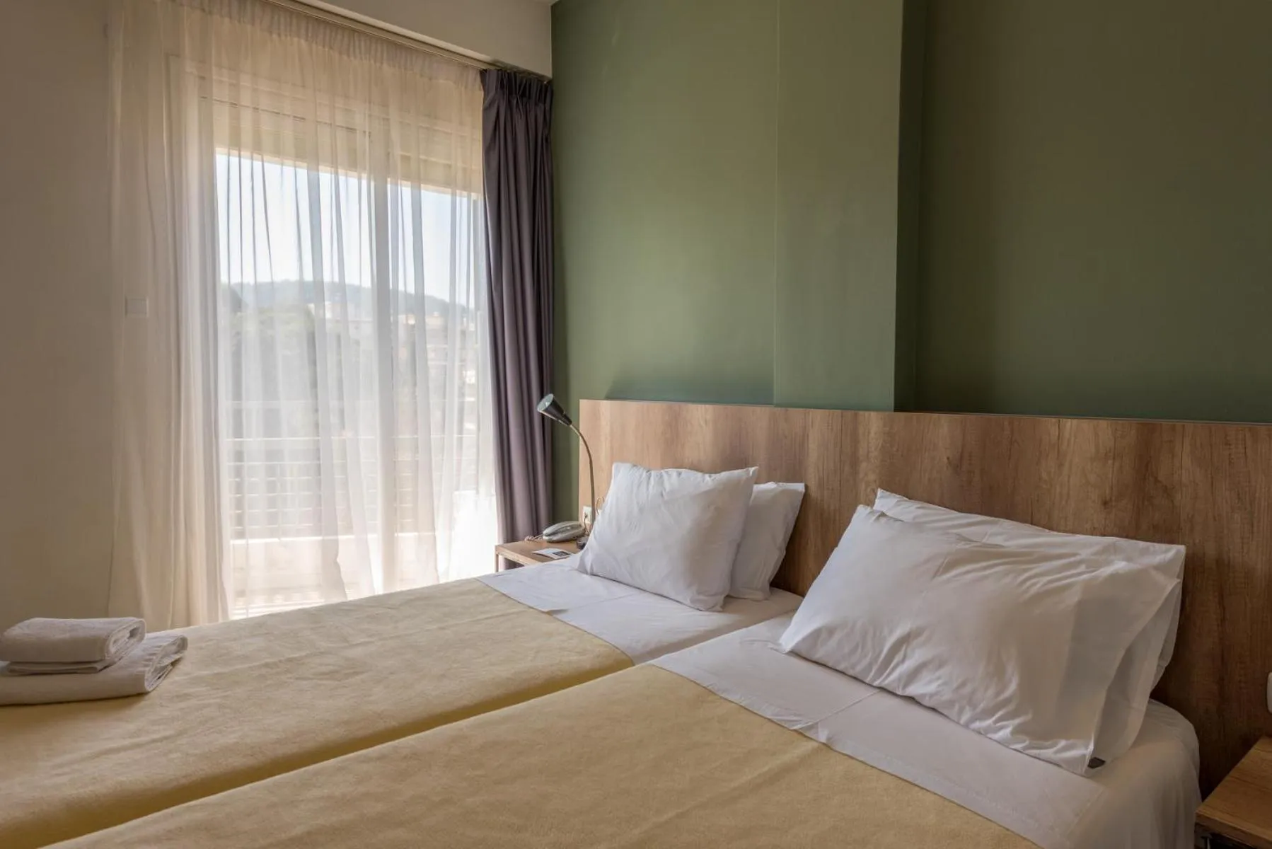 Bed in Alexios Hotel