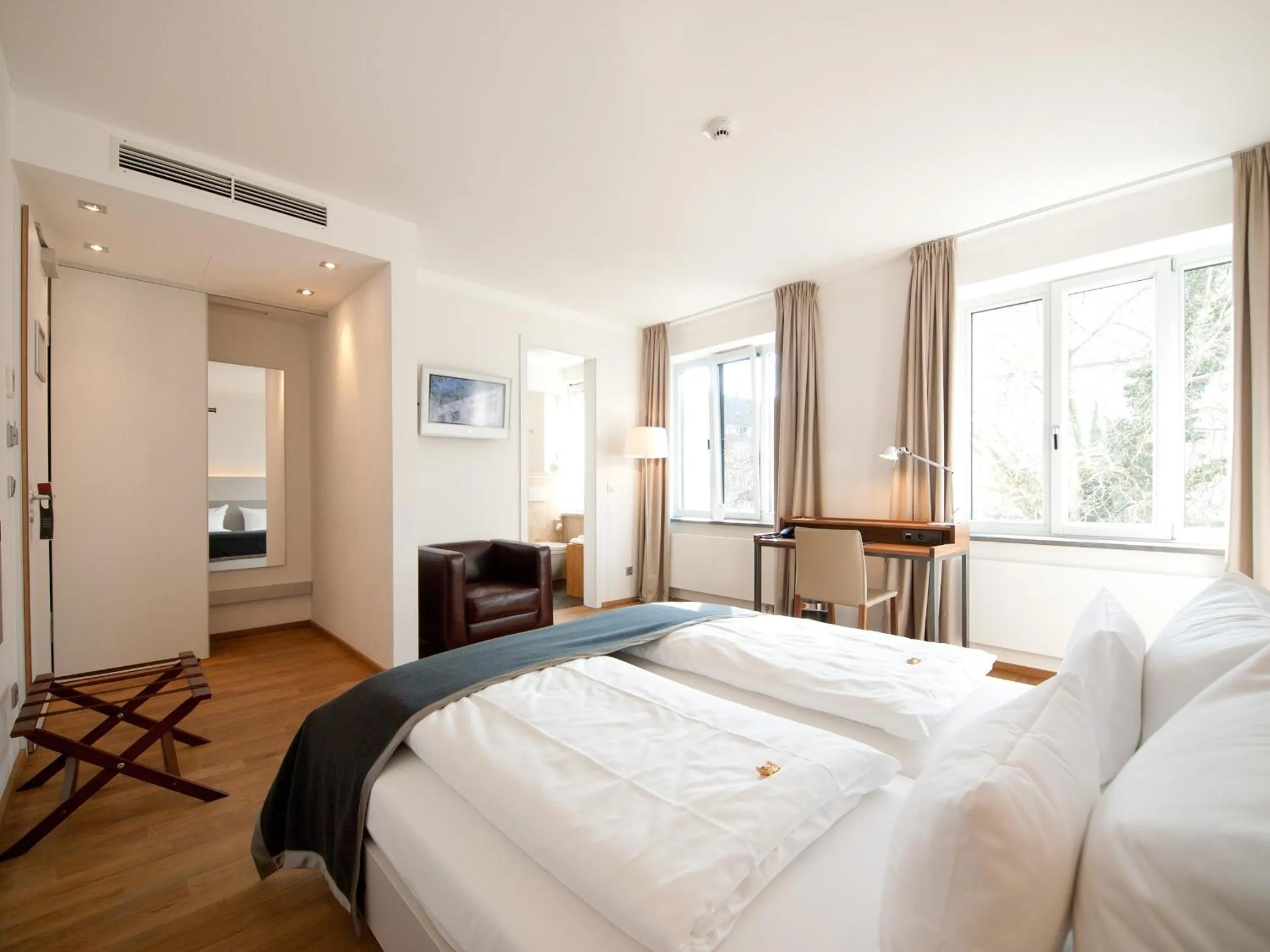 Photo of the whole room, Bed in Qube Hotel Bergheim