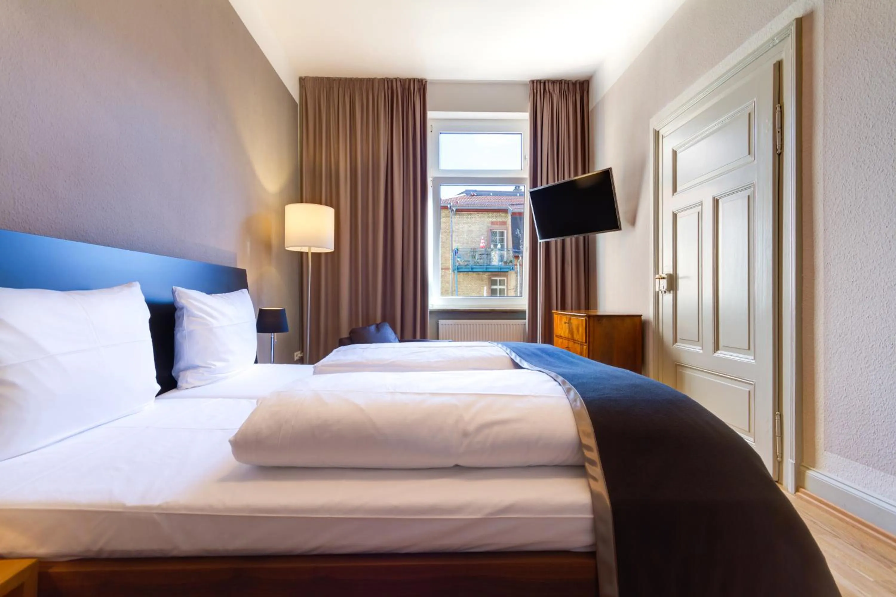 Photo of the whole room, Bed in Qube Hotel Bergheim