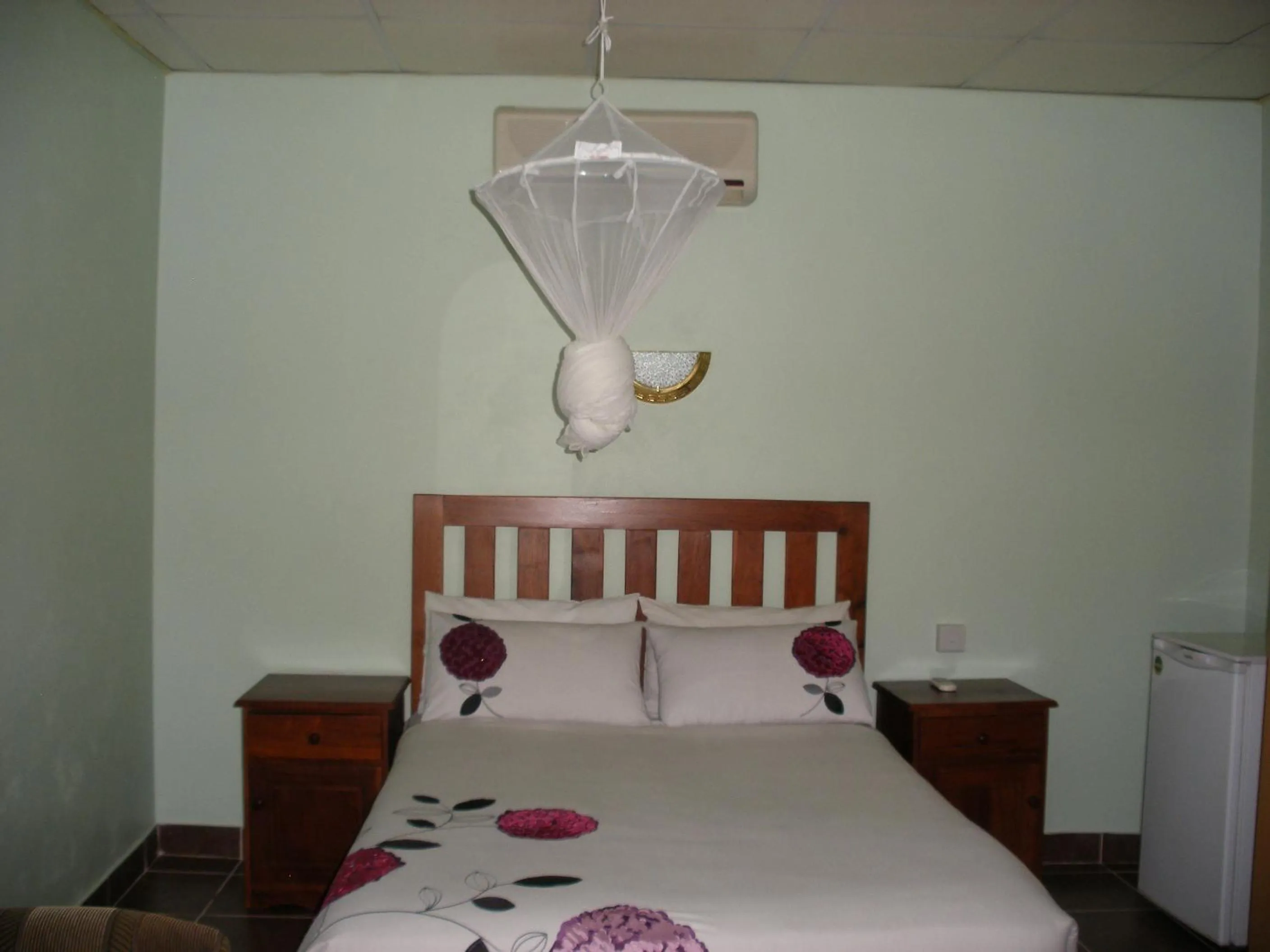 Bed in Gloria's Bed and Breakfast