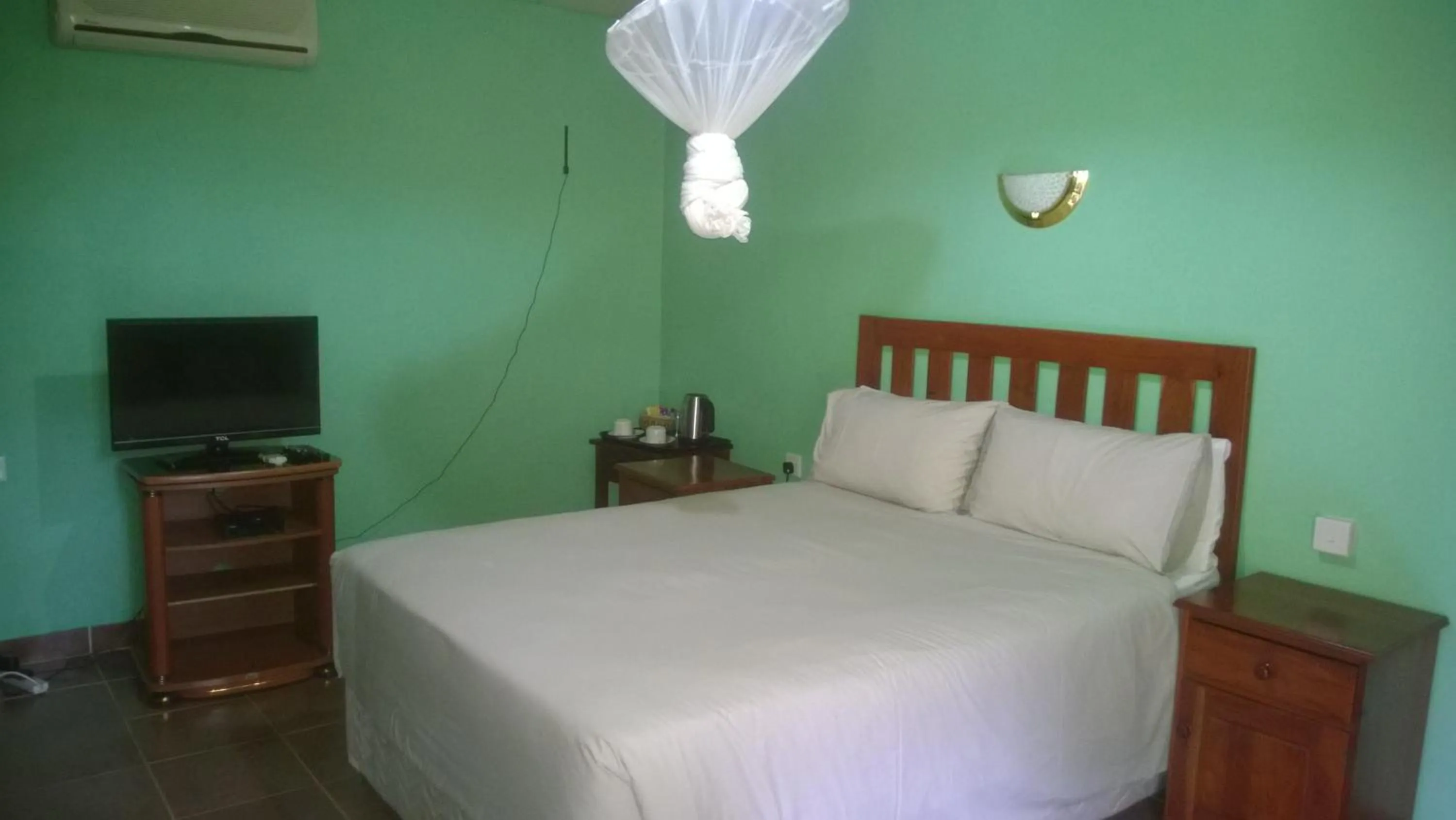 Bed in Gloria's Bed and Breakfast