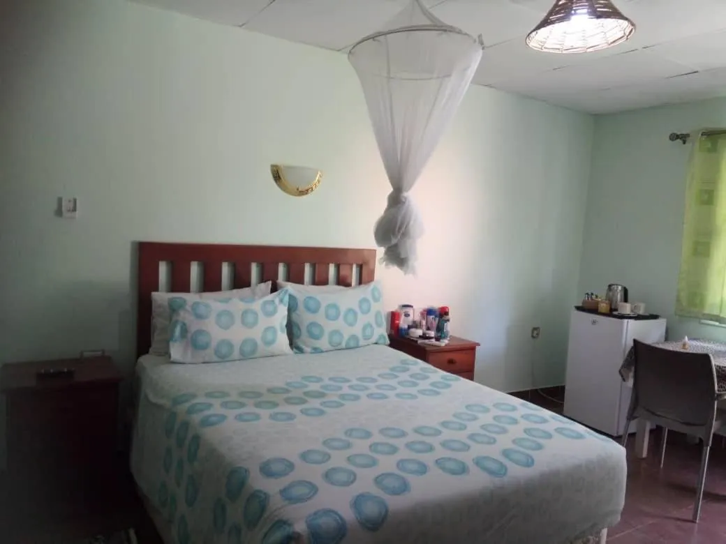 Bed in Gloria's Bed and Breakfast