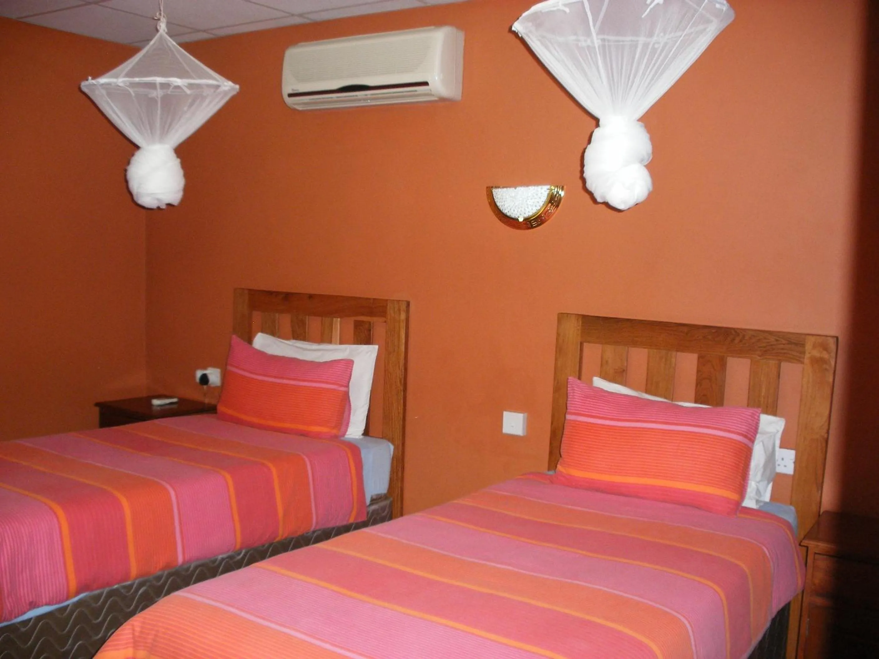 Bed in Gloria's Bed and Breakfast