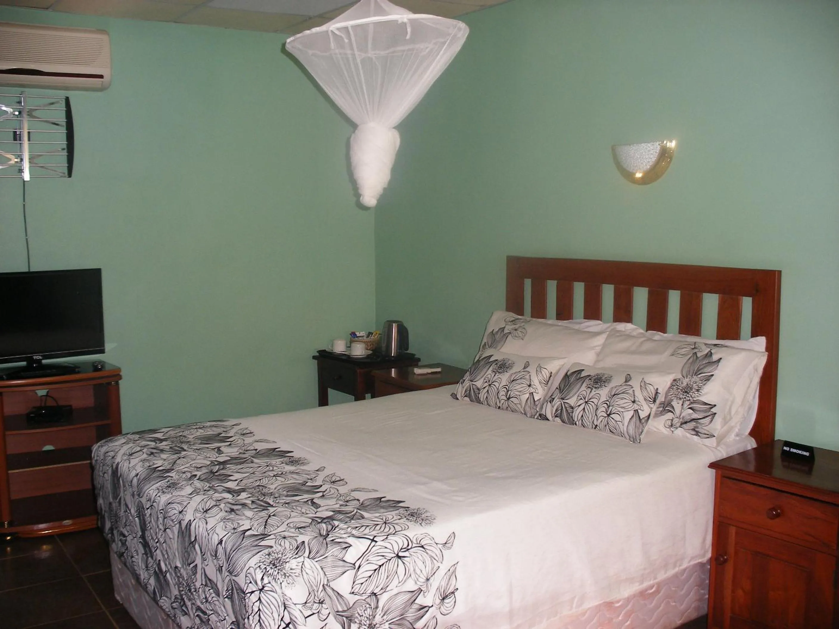 Bed in Gloria's Bed and Breakfast