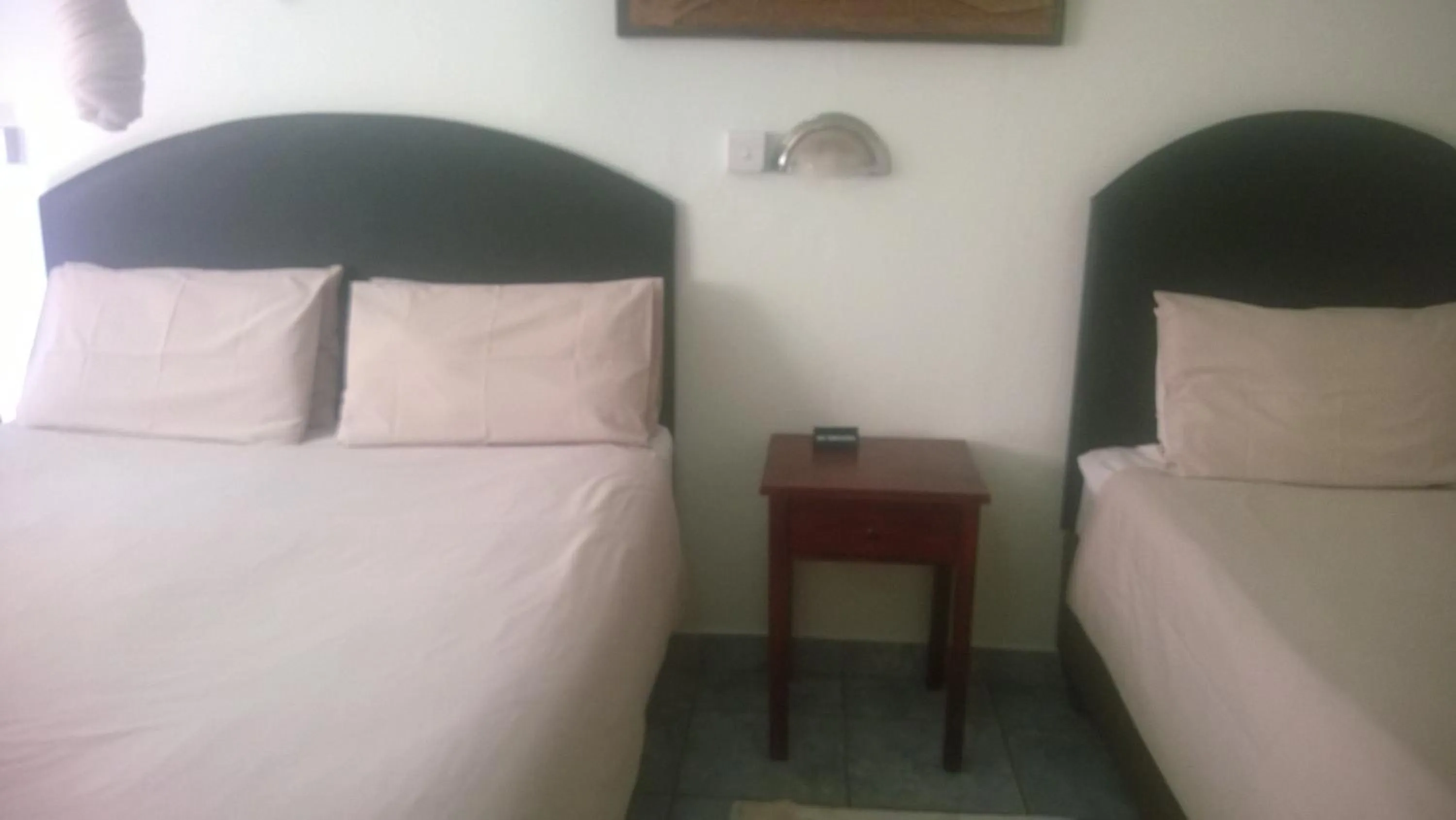 Bed in Gloria's Bed and Breakfast