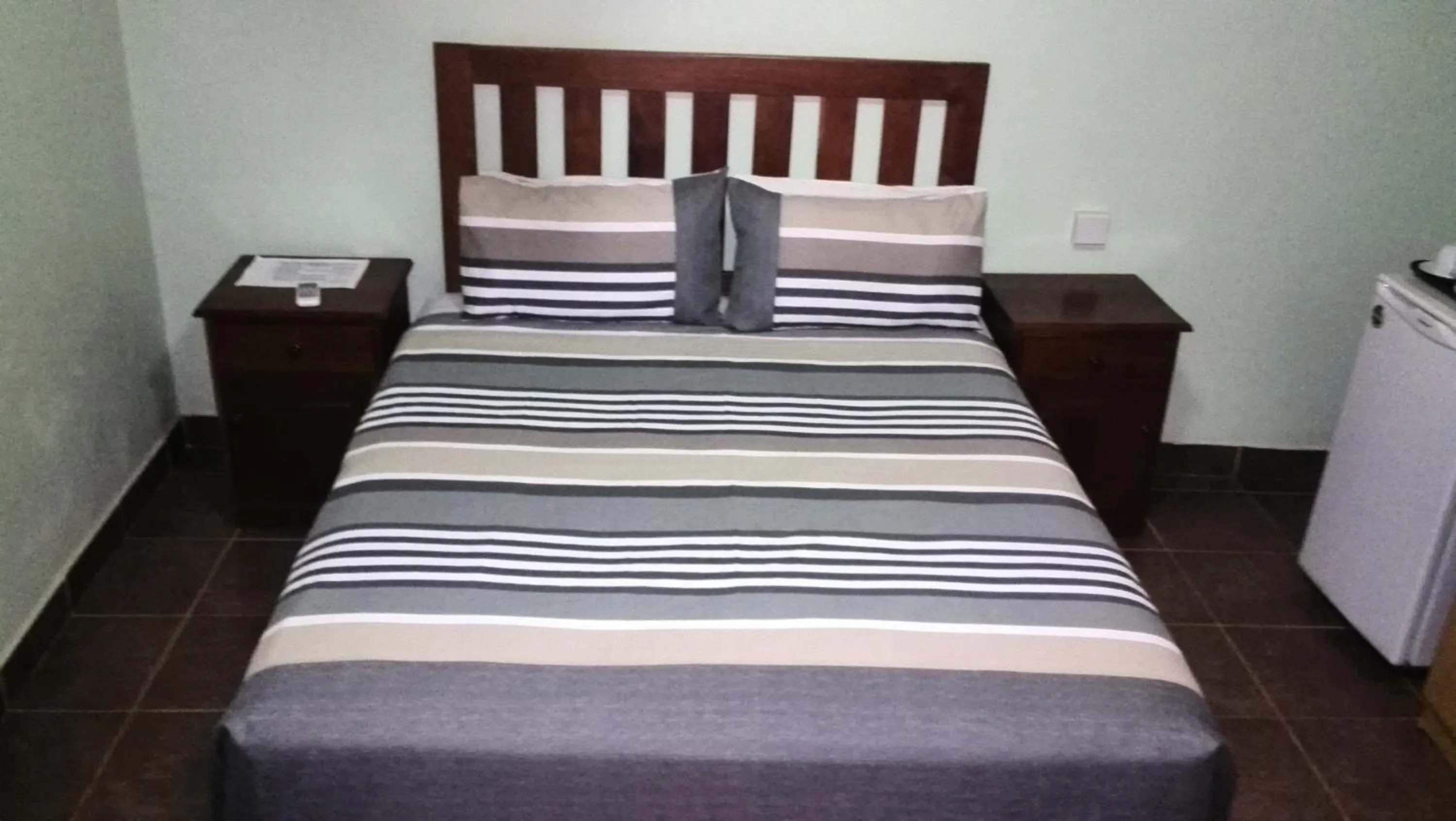 Bed in Gloria's Bed and Breakfast