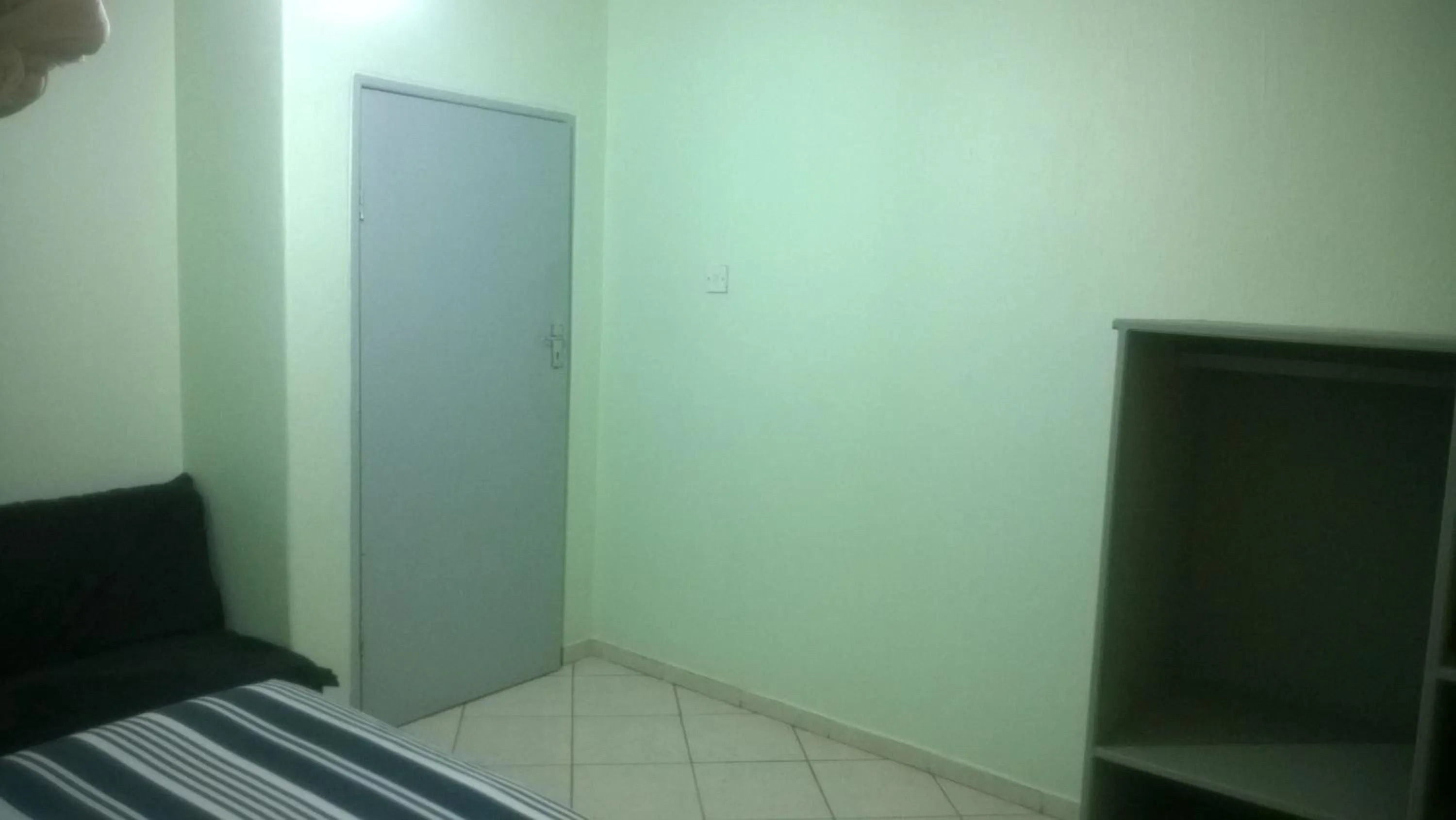 Bed in Gloria's Bed and Breakfast