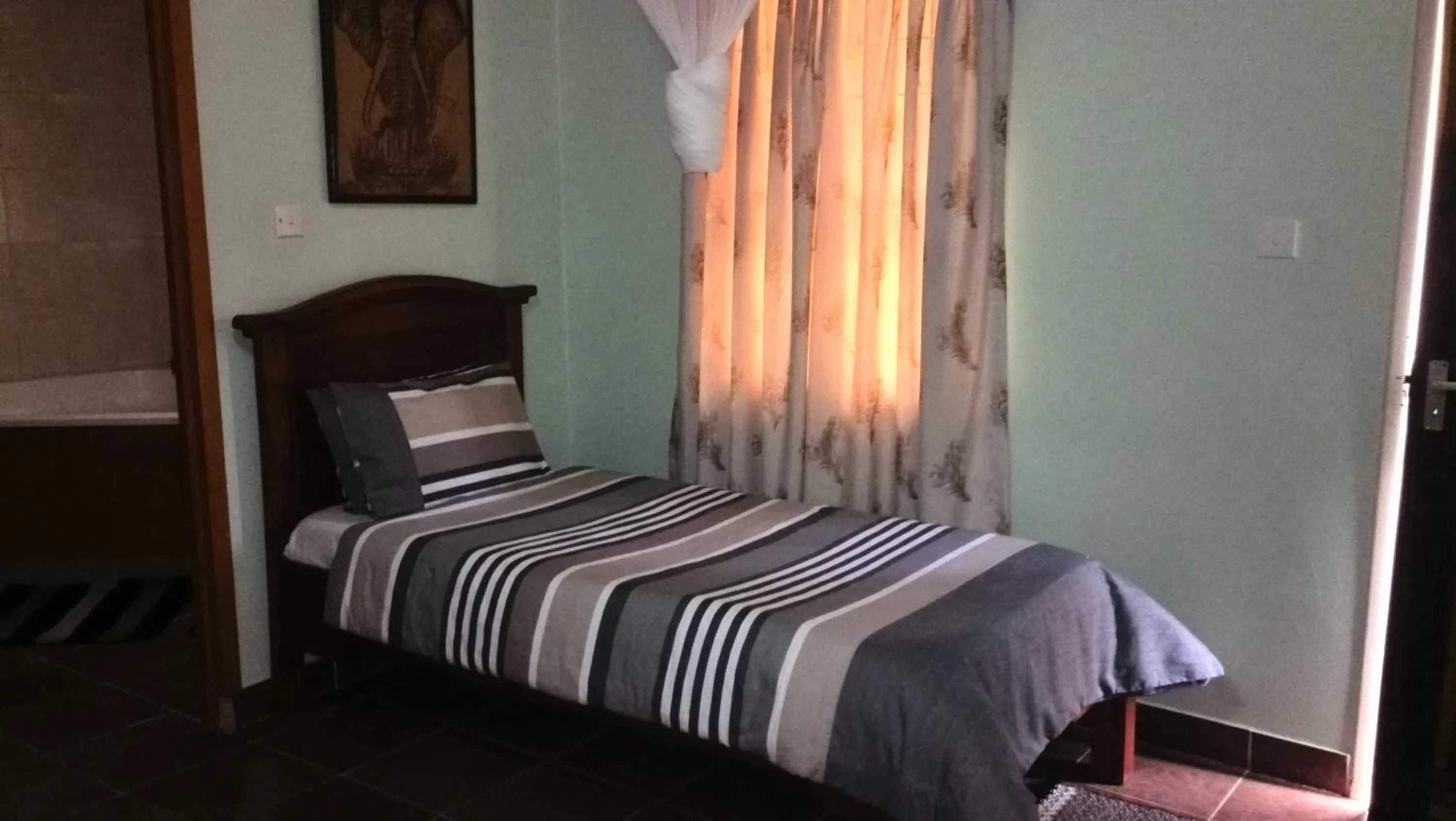 Bed in Gloria's Bed and Breakfast