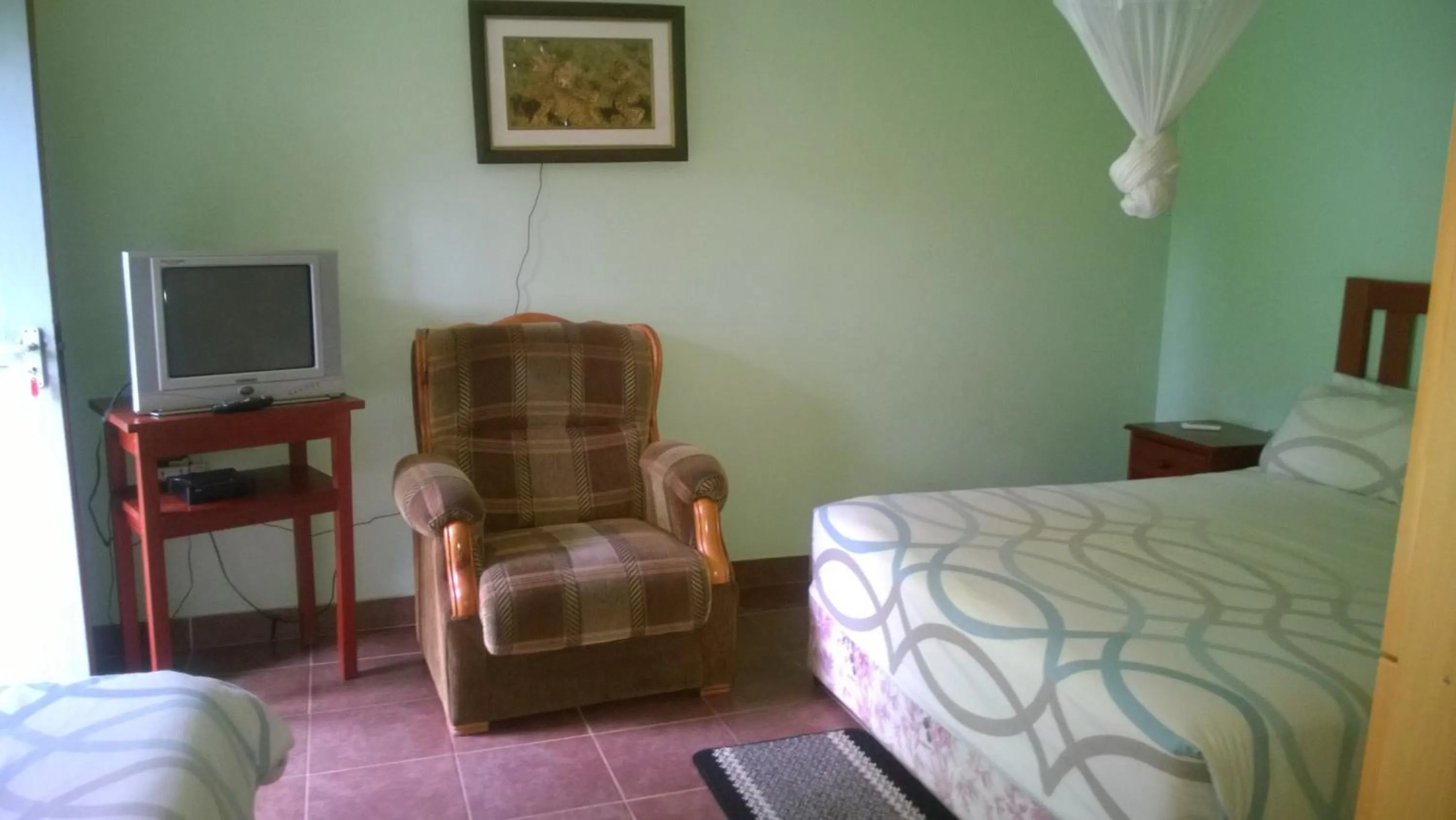 Bed in Gloria's Bed and Breakfast