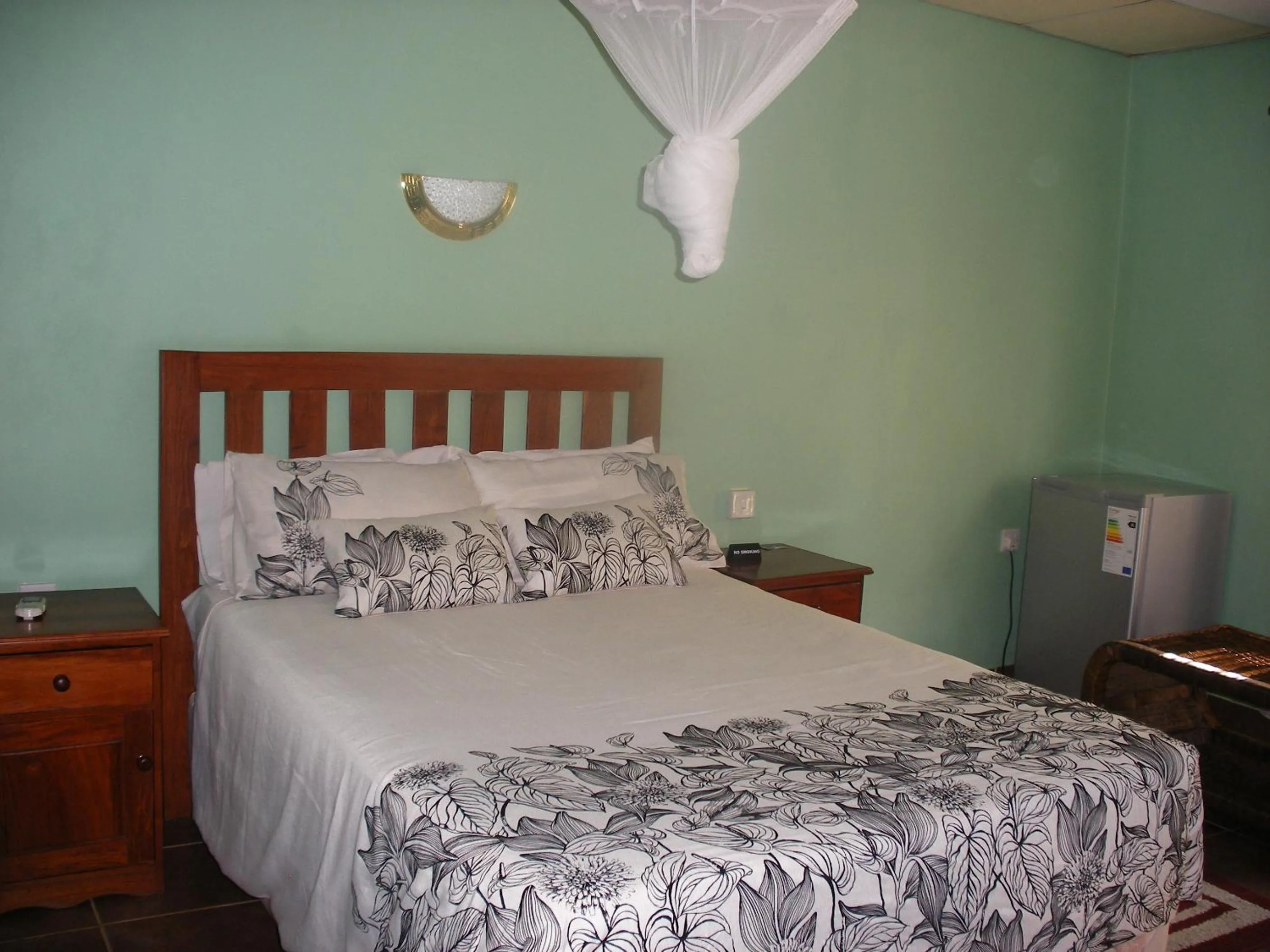 Bed in Gloria's Bed and Breakfast