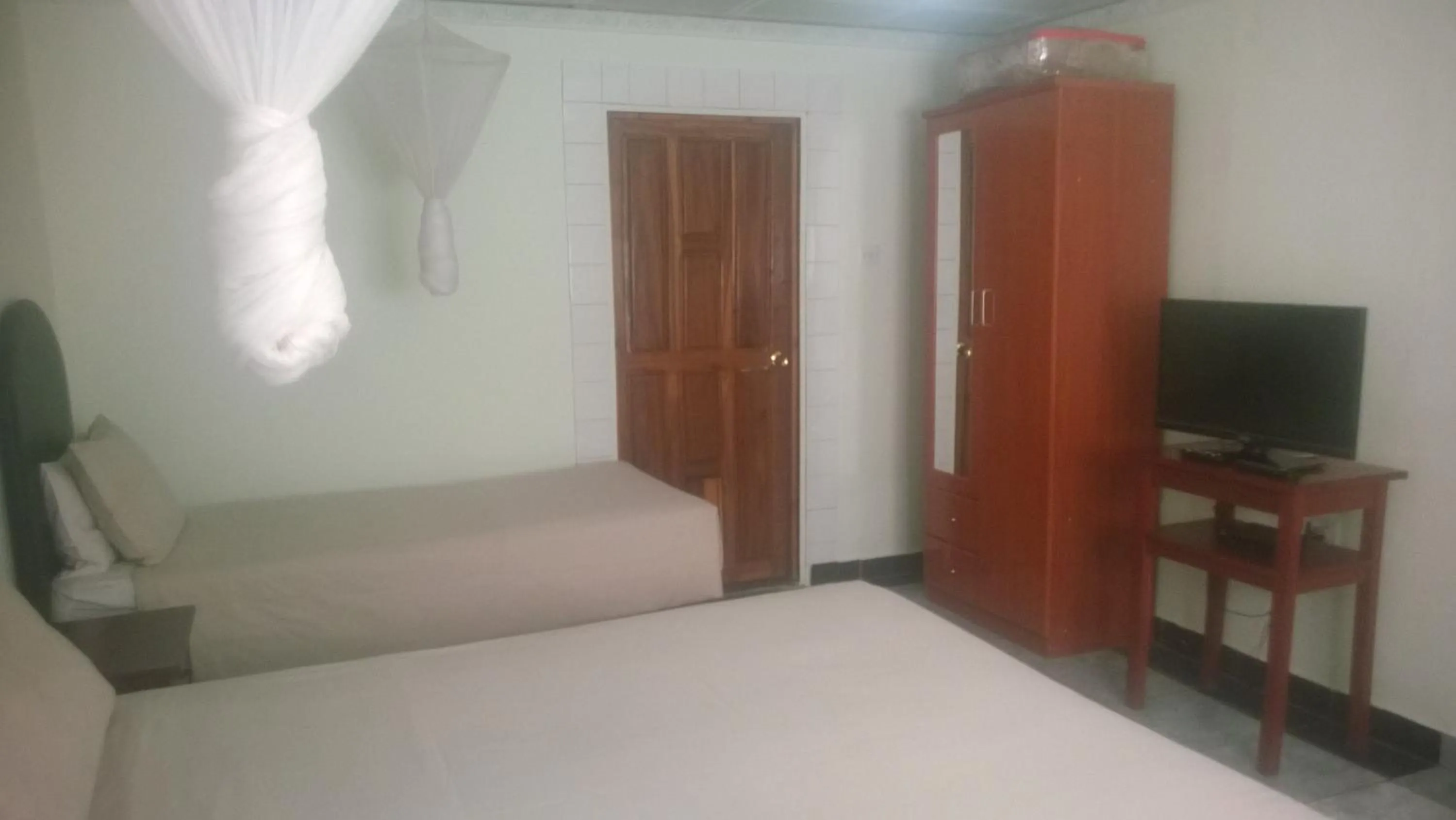 Bed in Gloria's Bed and Breakfast