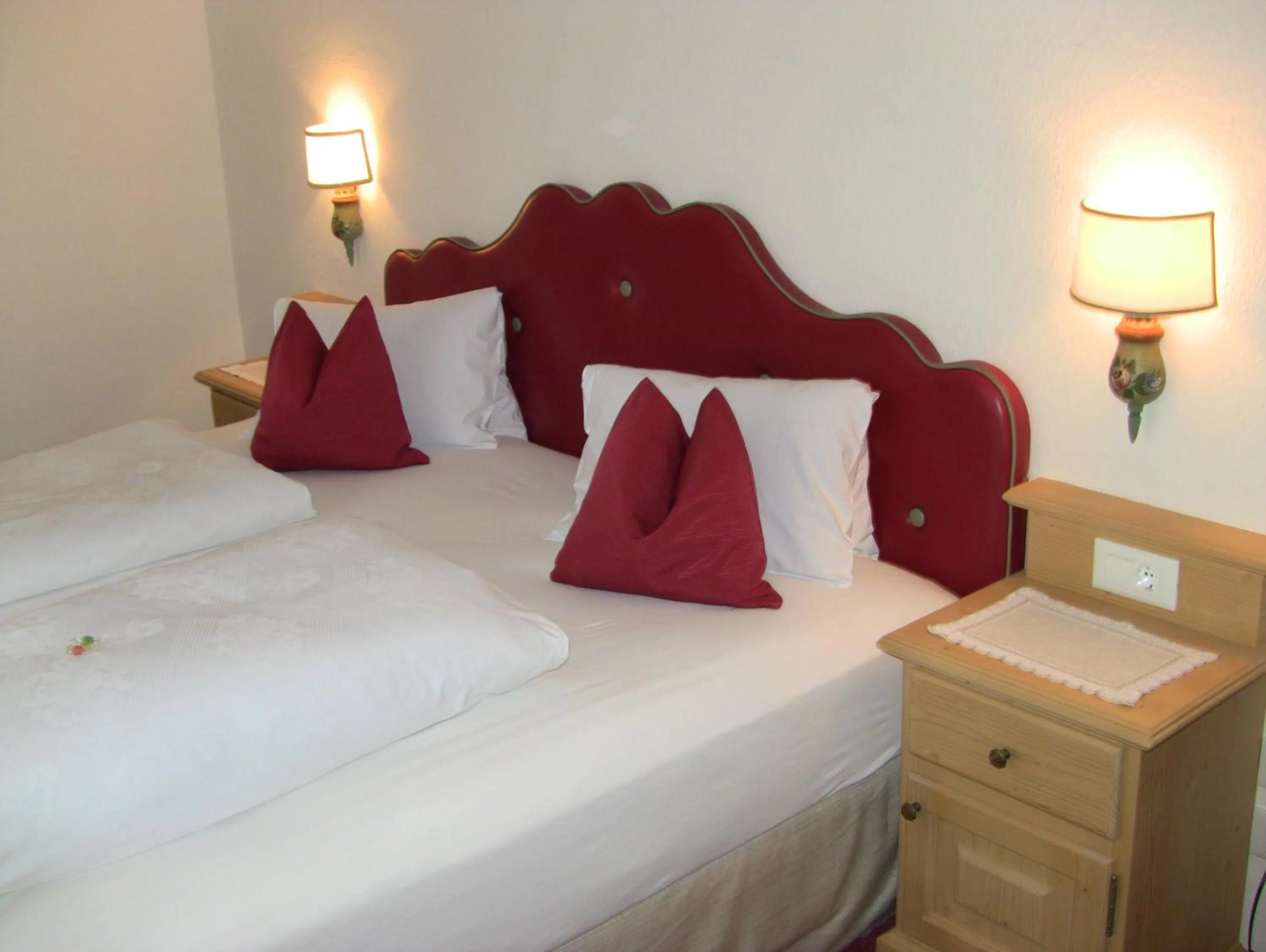 Bed in PALMENGARTEN Hotel Gstör