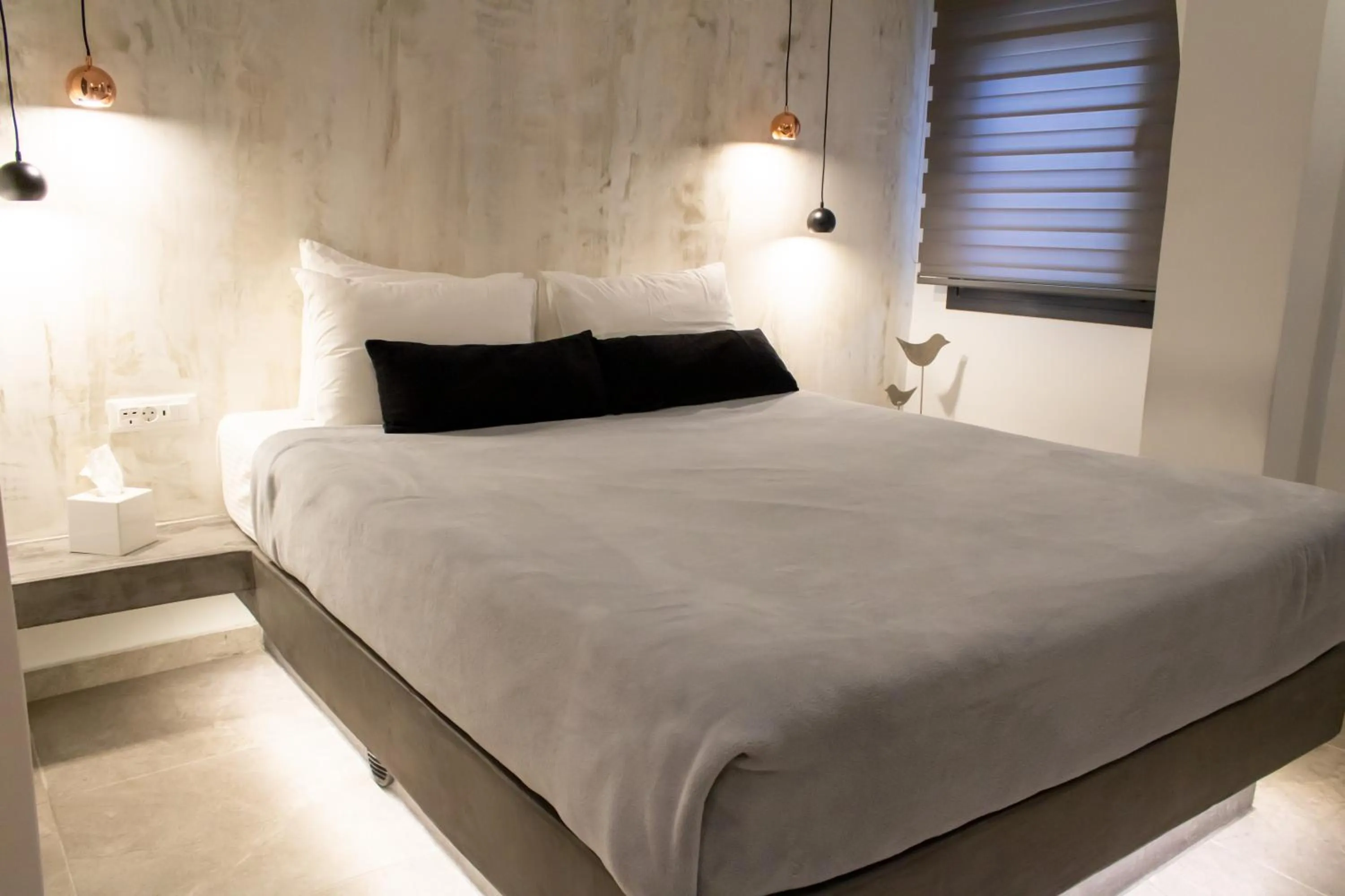 Bed in George & Joanna Suites Santorini