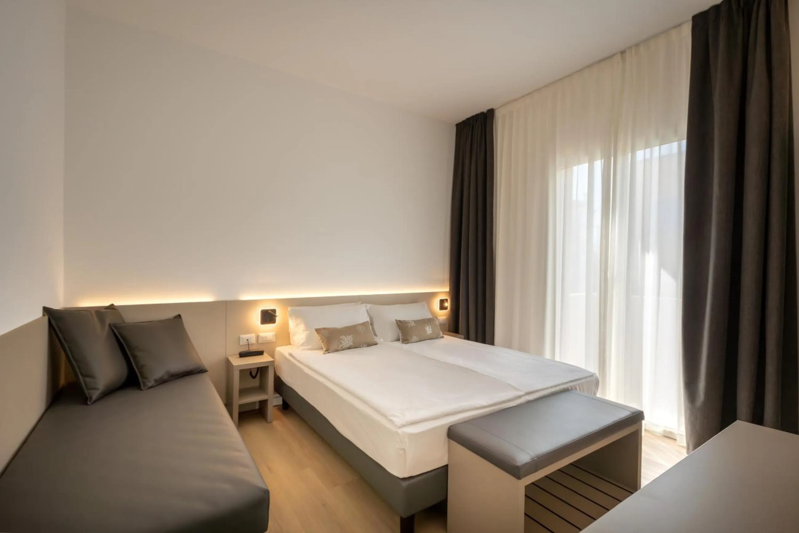 Bed in Hotel Delfino