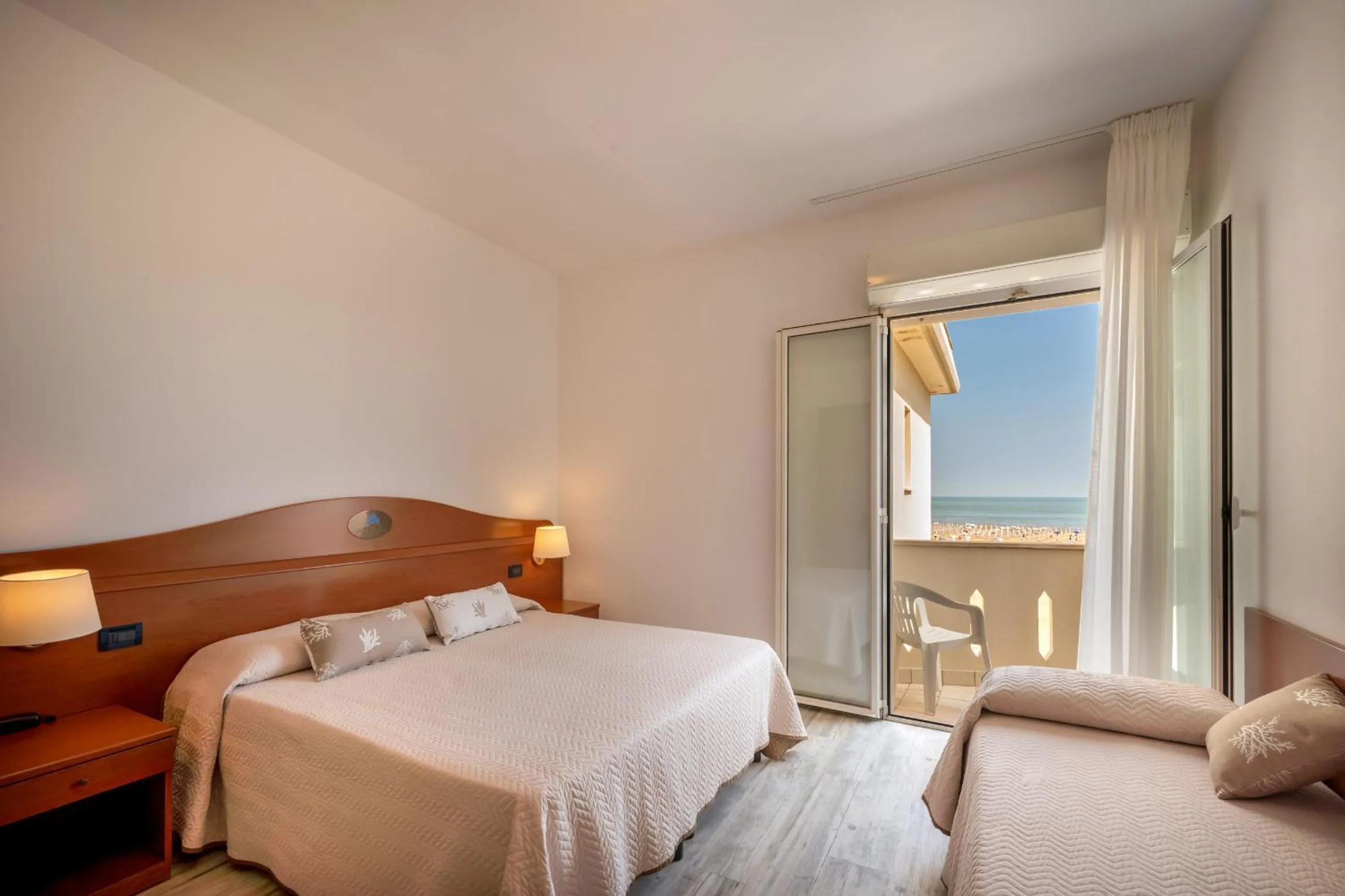 Bed in Hotel Delfino