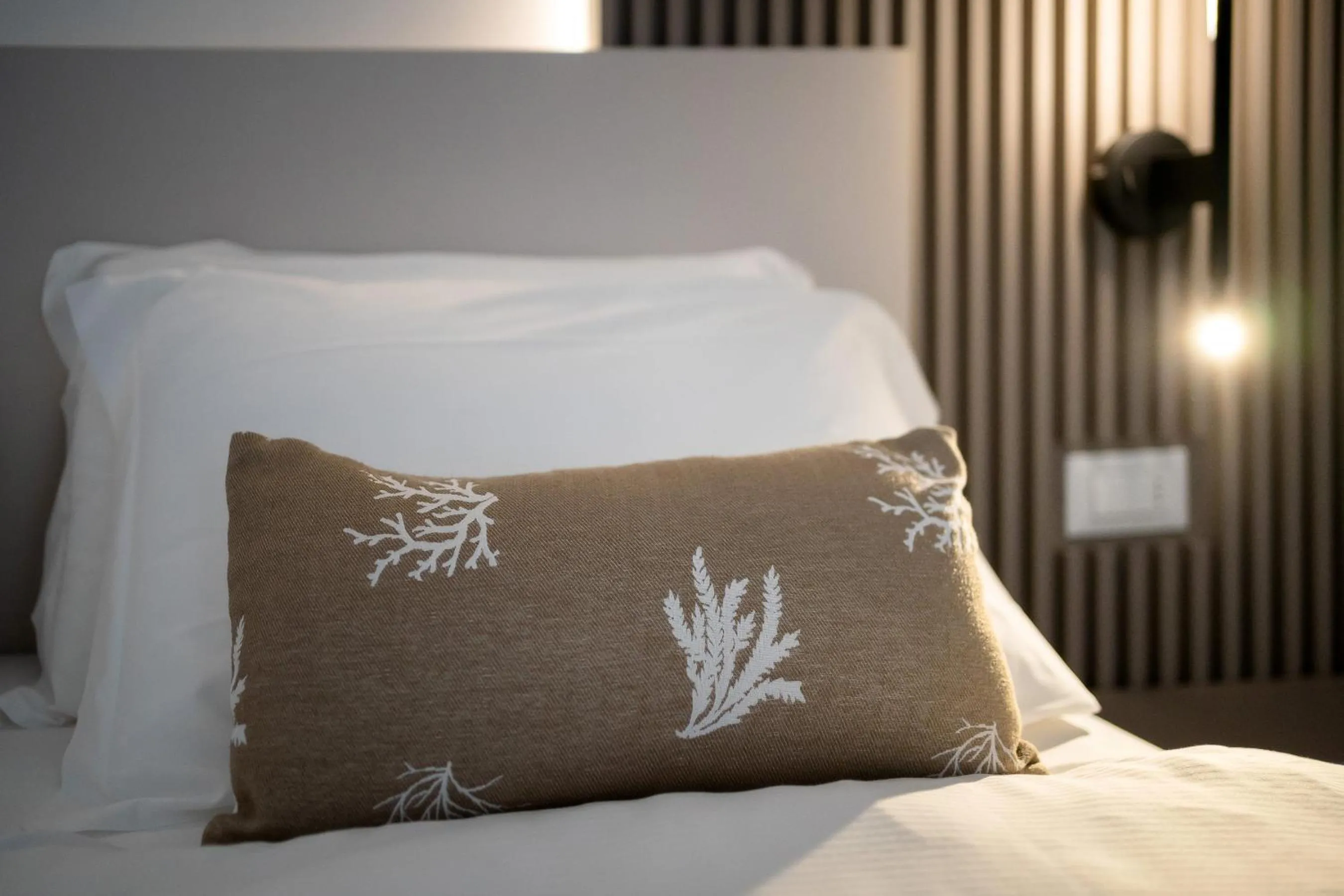 Bed in Hotel Delfino