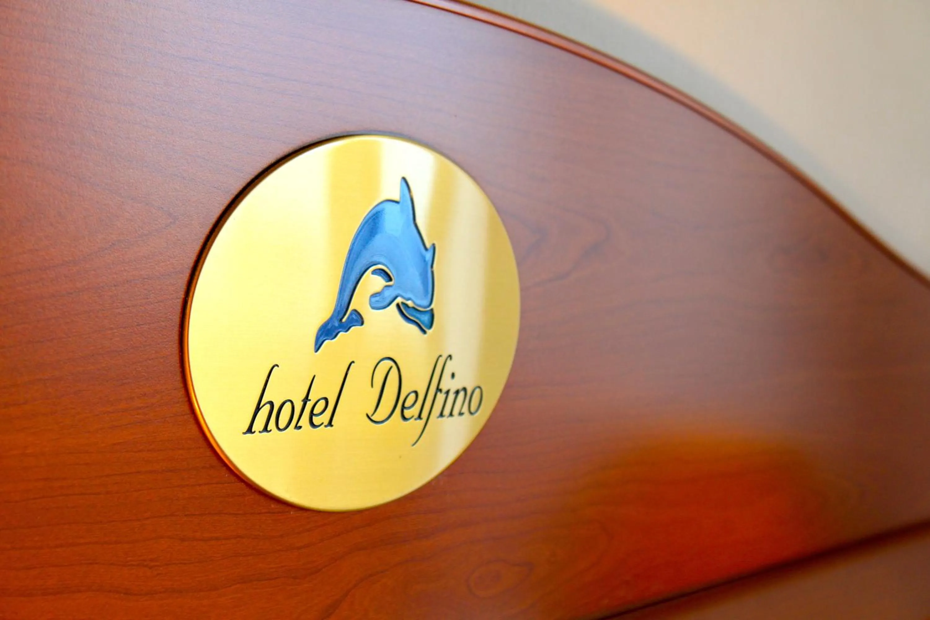 Property logo or sign in Hotel Delfino