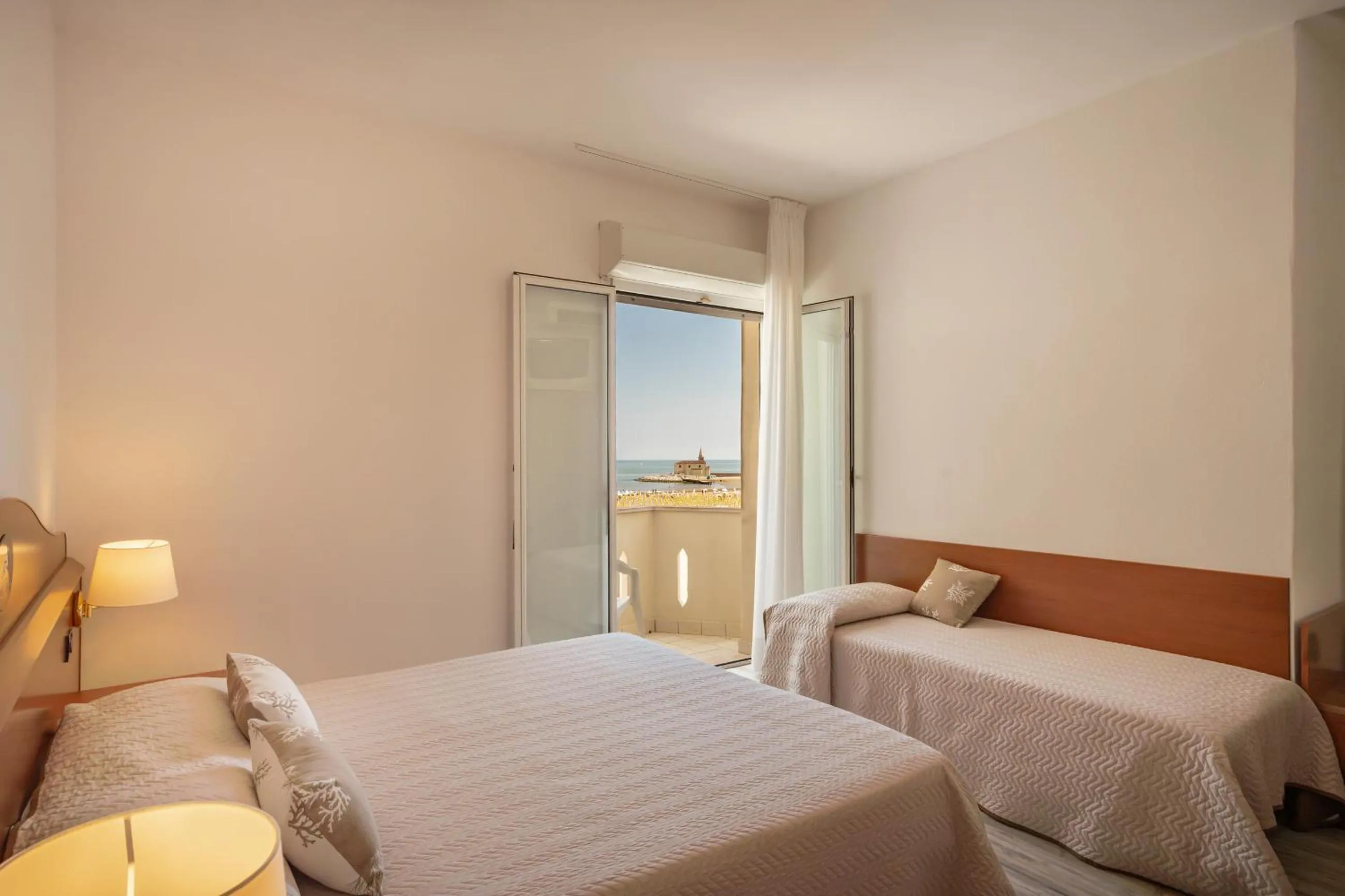 Bed in Hotel Delfino