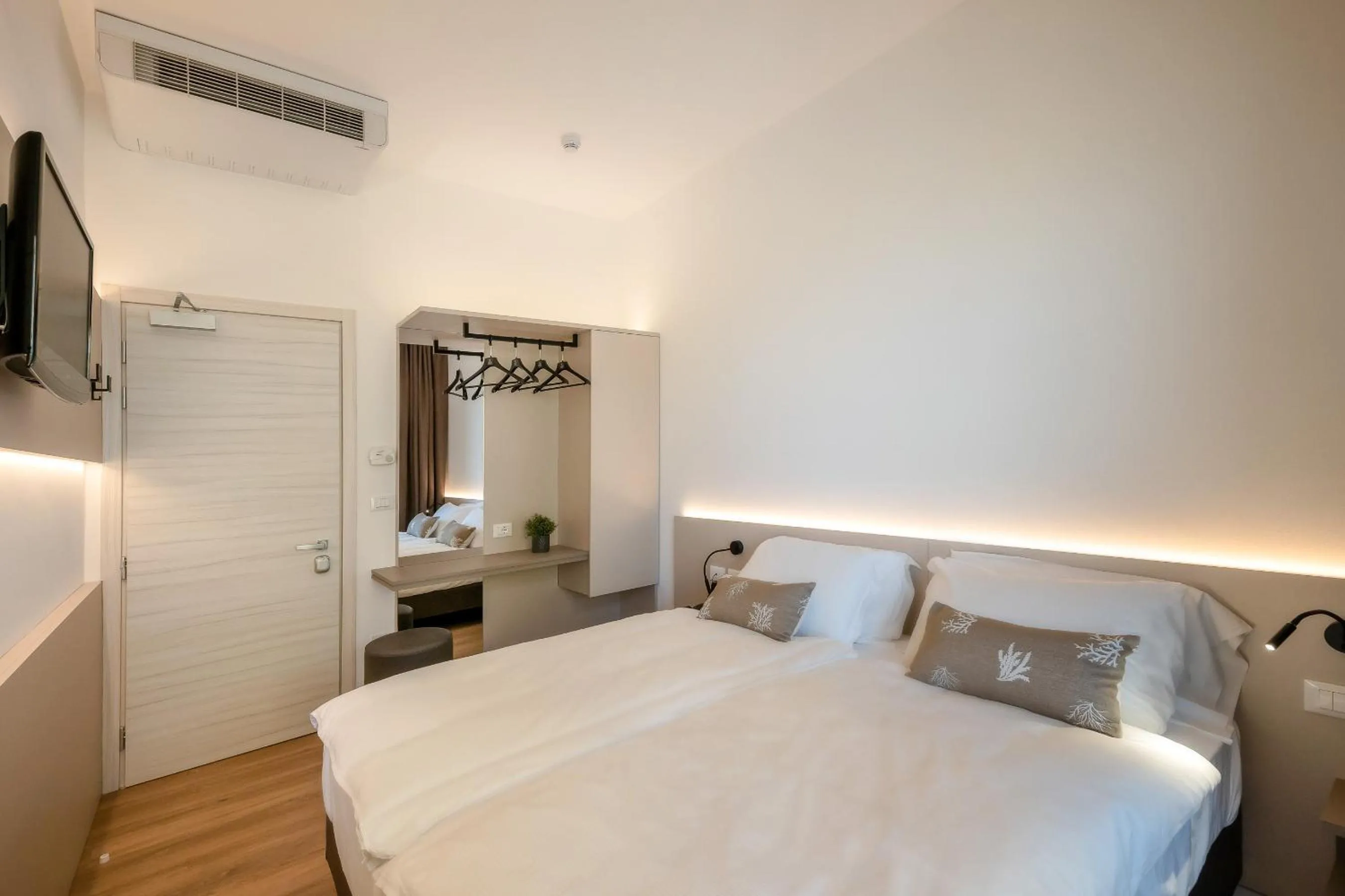Bed in Hotel Delfino