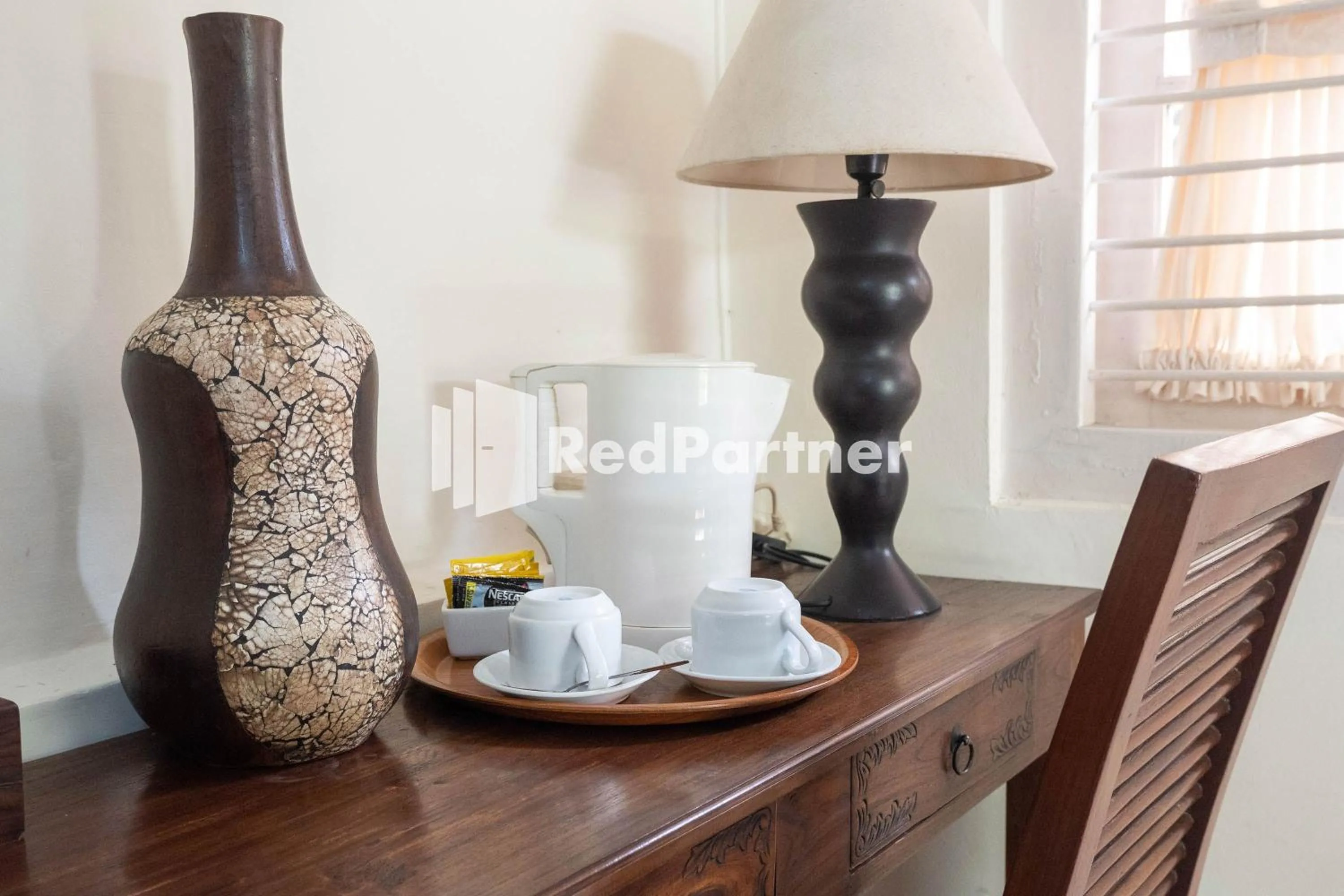 Coffee/tea facilities in Monginsidi Guest House Syariah Malioboro Yogyakarta Mitra RedDoorz