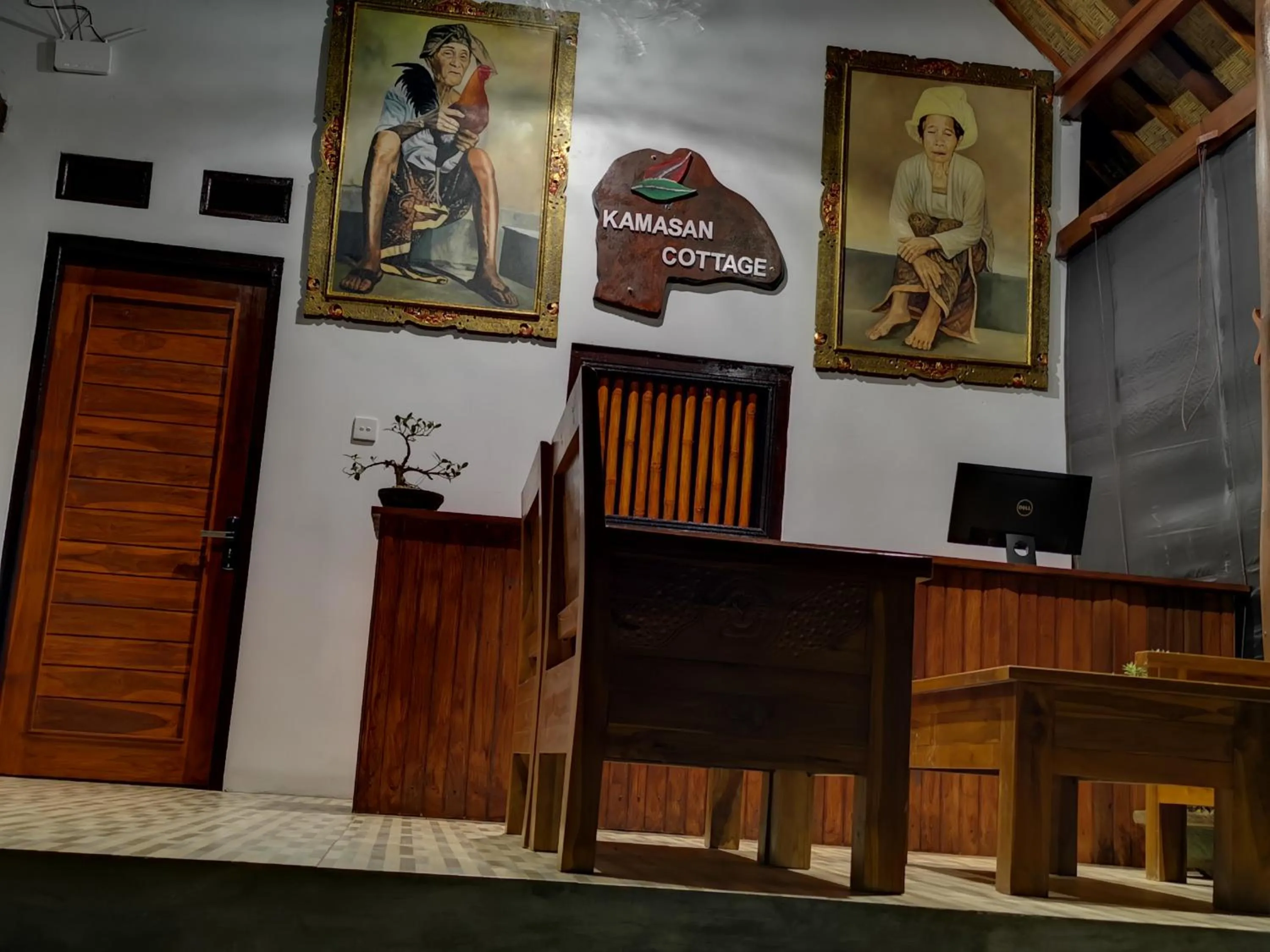 Property logo or sign in Kamasan Cottage By Reccoma