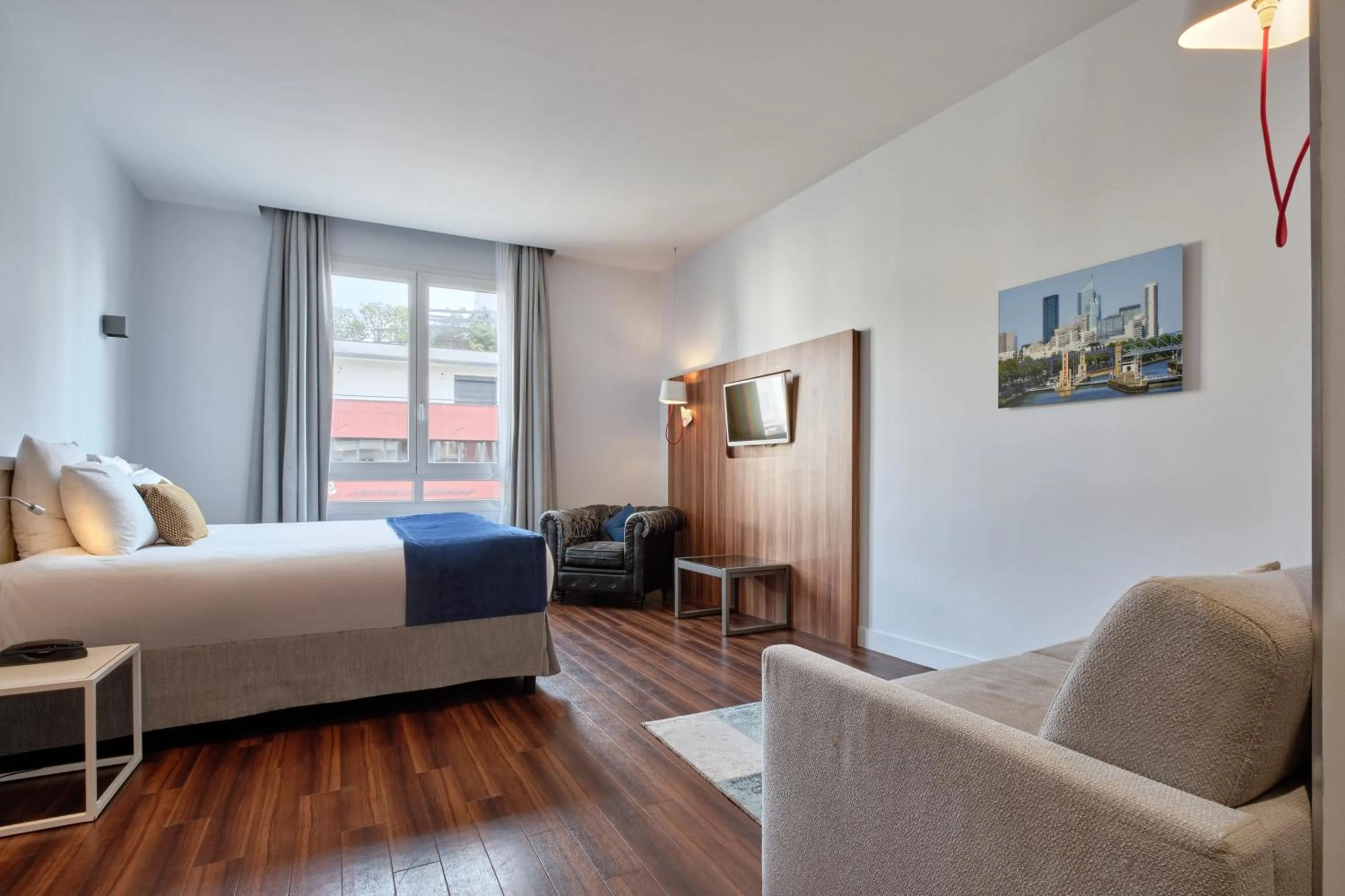 Photo of the whole room, Bed in Hotel Atrium by Happyculture