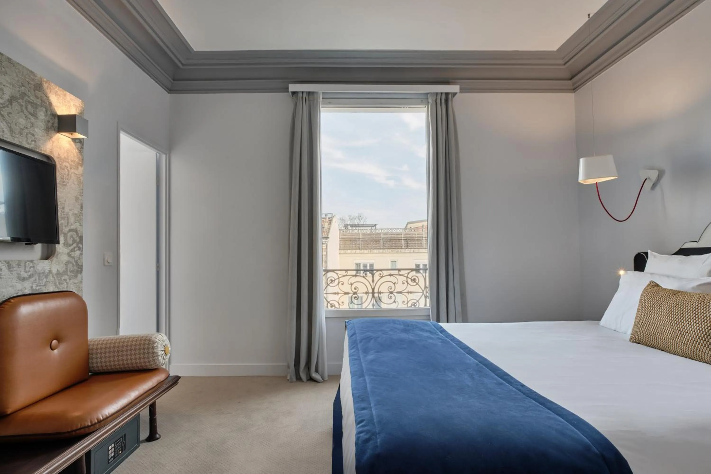 Bed in Hotel Atrium by Happyculture