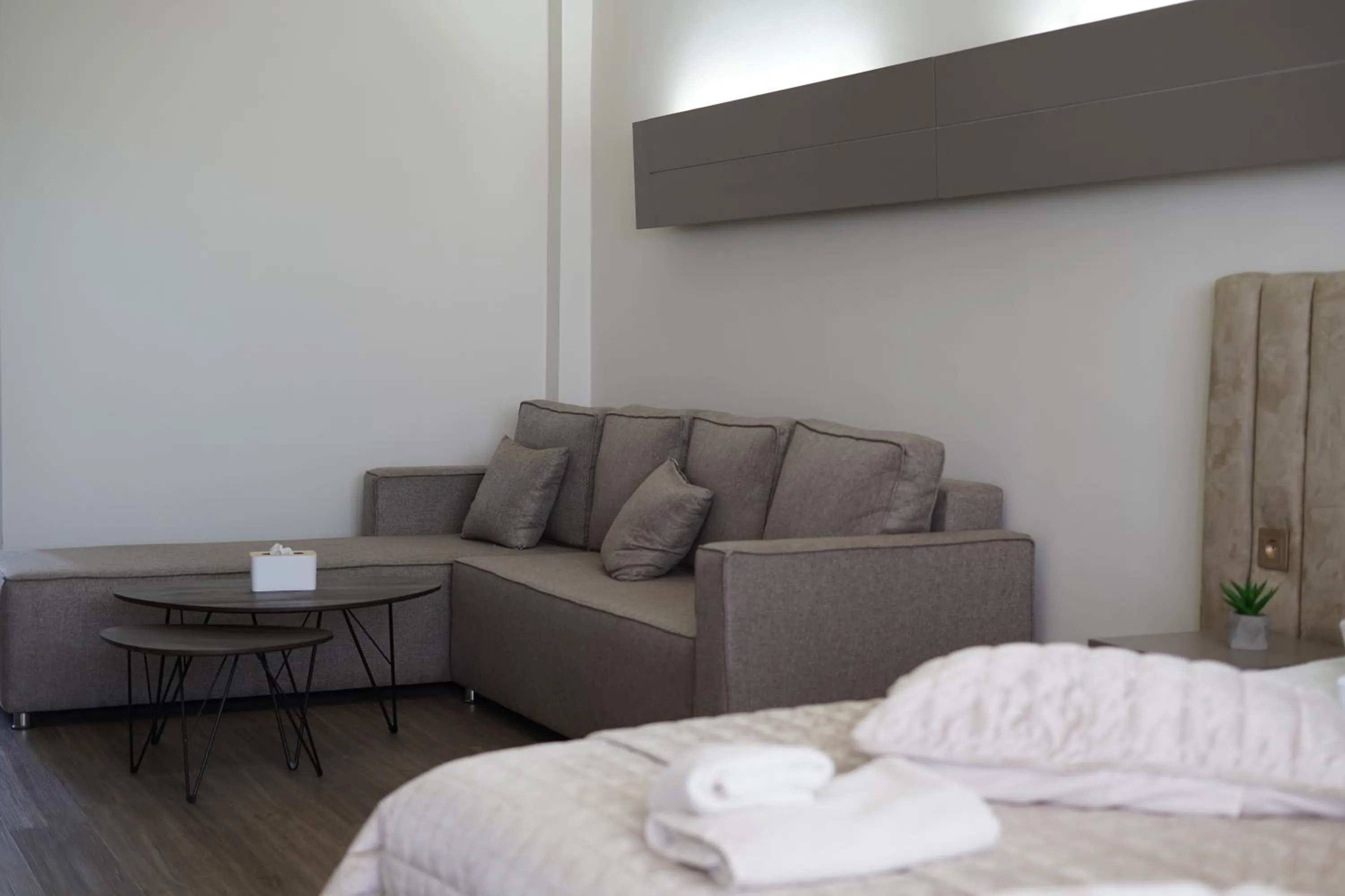 Living room, Bed in Cross Resort Hotel