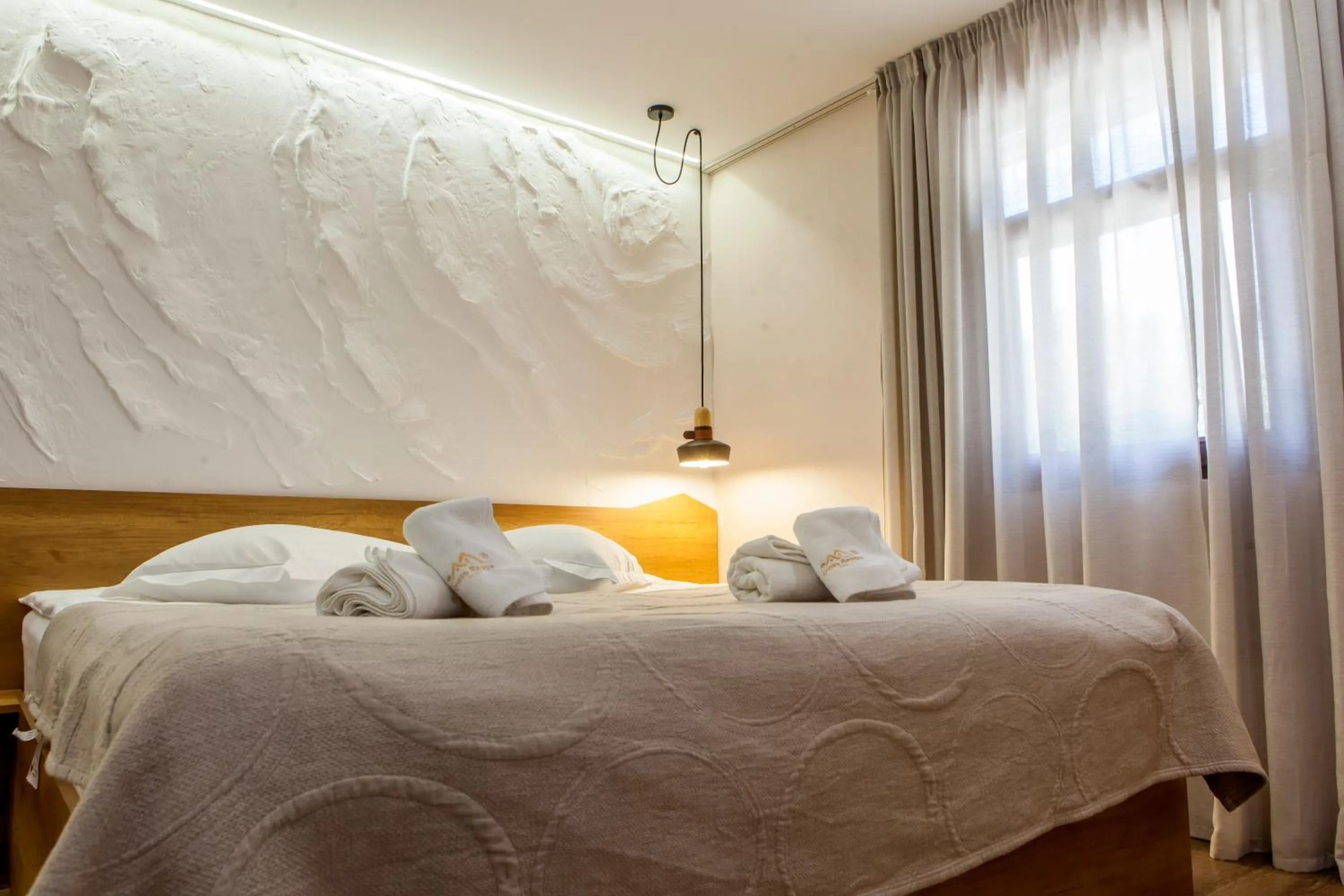 Bed in Cross Resort Hotel