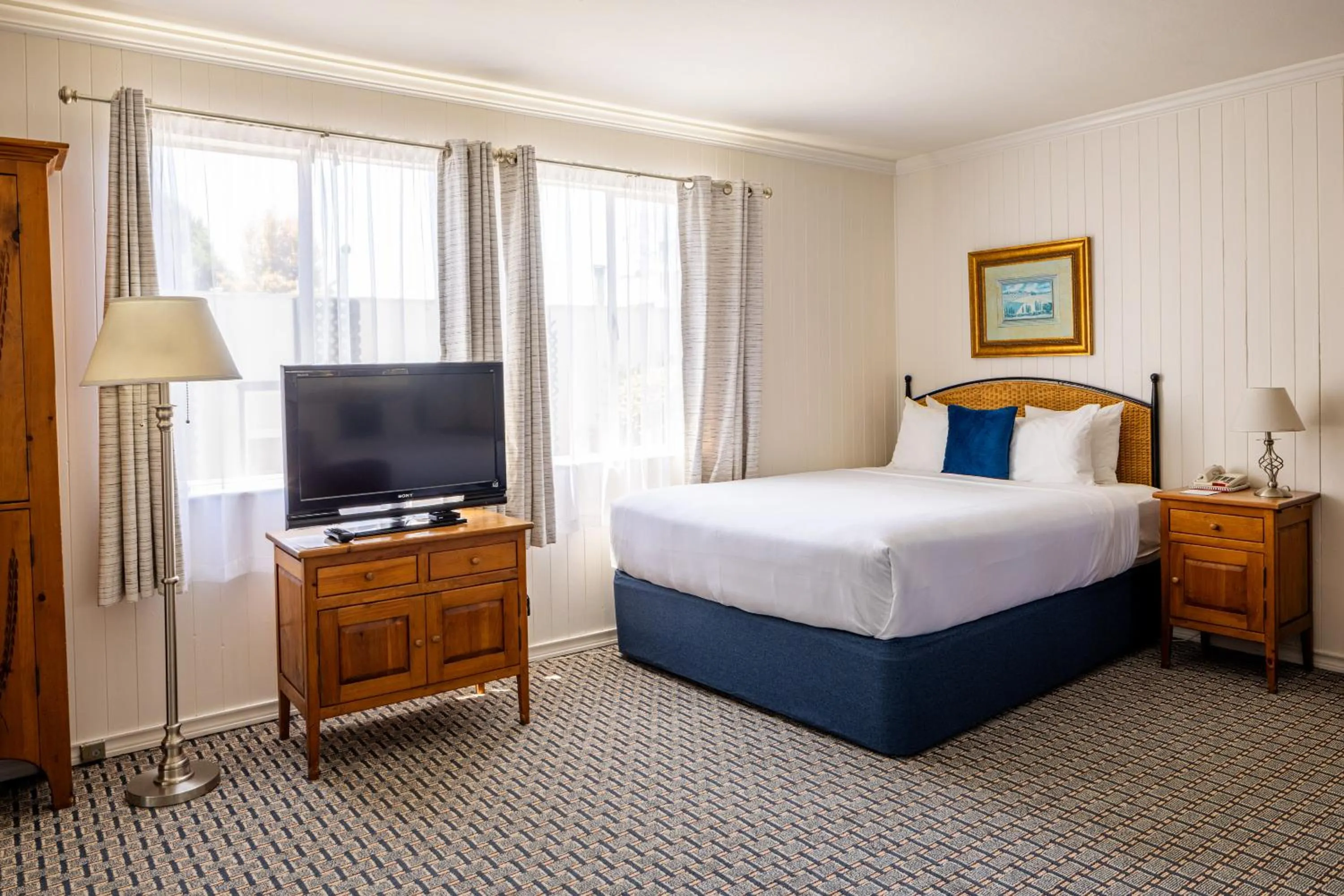 Bed in Carmel Fireplace Inn