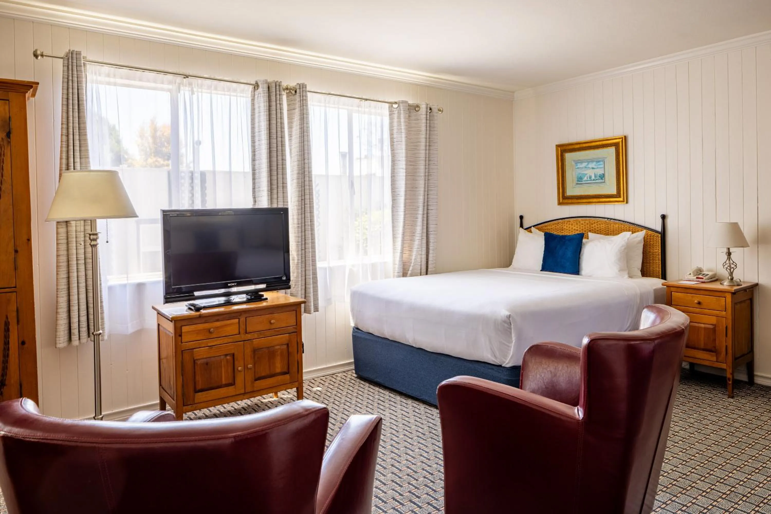 Bed in Carmel Fireplace Inn