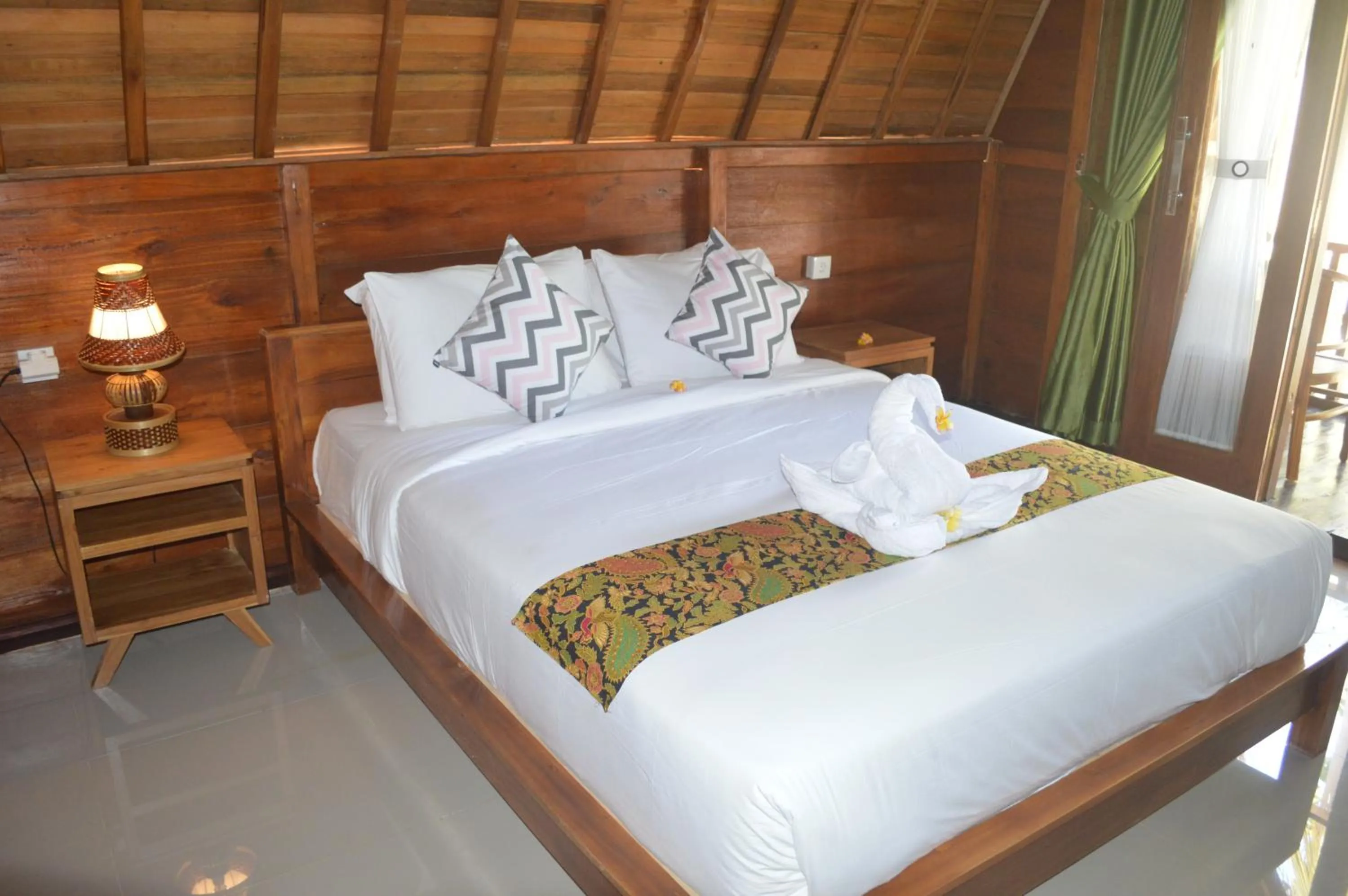 Bed in Nyuh Gading Bungalow Nusa Penida