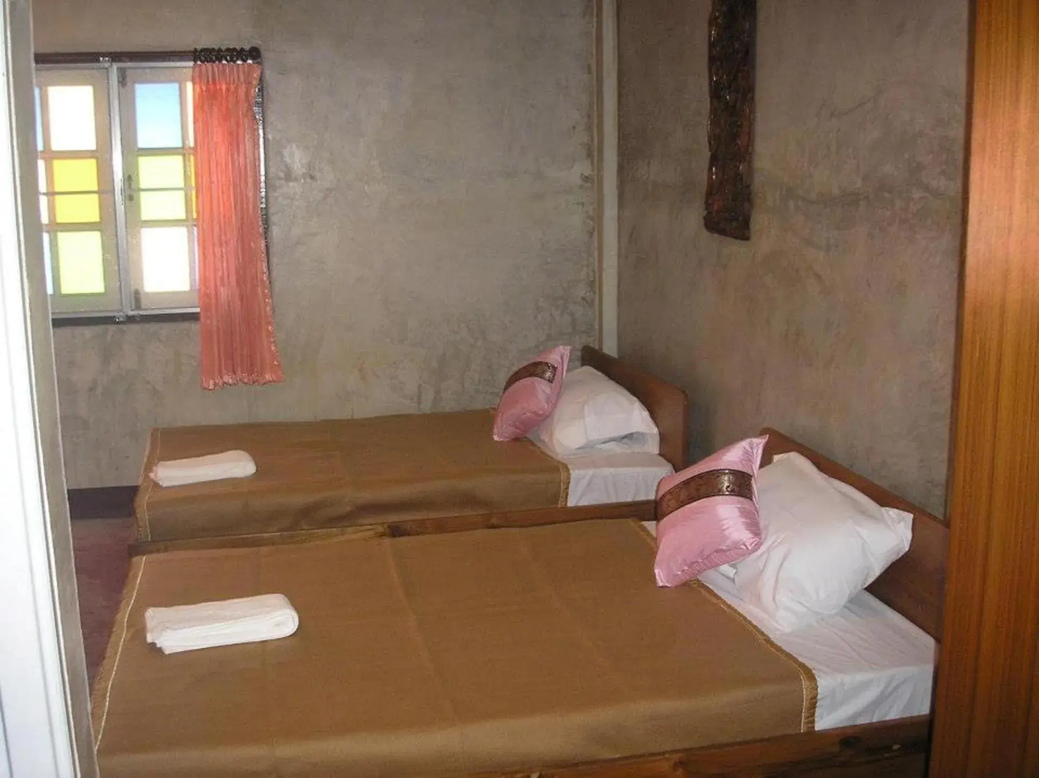 Bed in Tamarind Grand Resort Mae Sariang Bed in Tamarind Grand Resort Mae Sariang