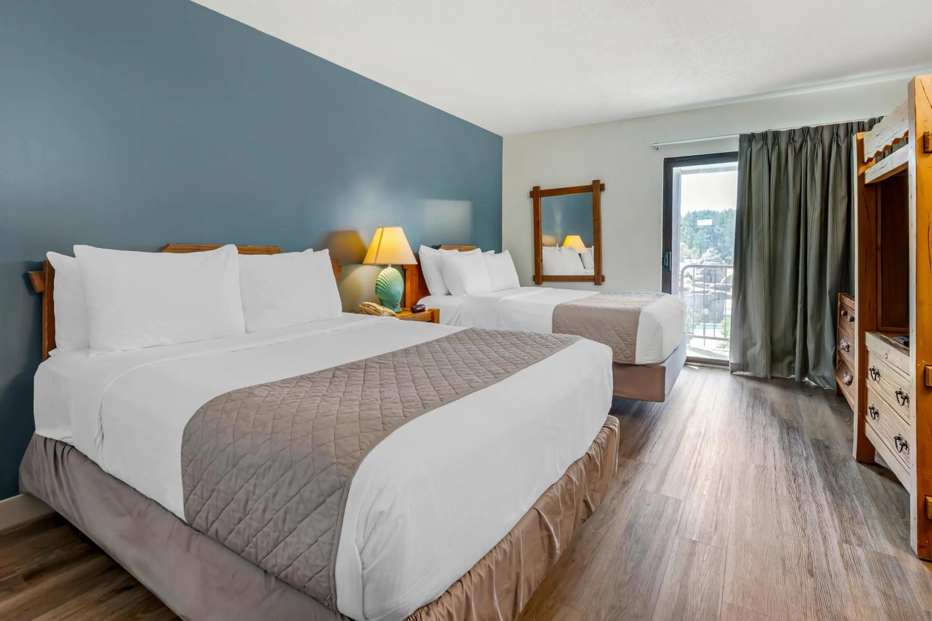 Bed in Polynesian Hotel & Suites