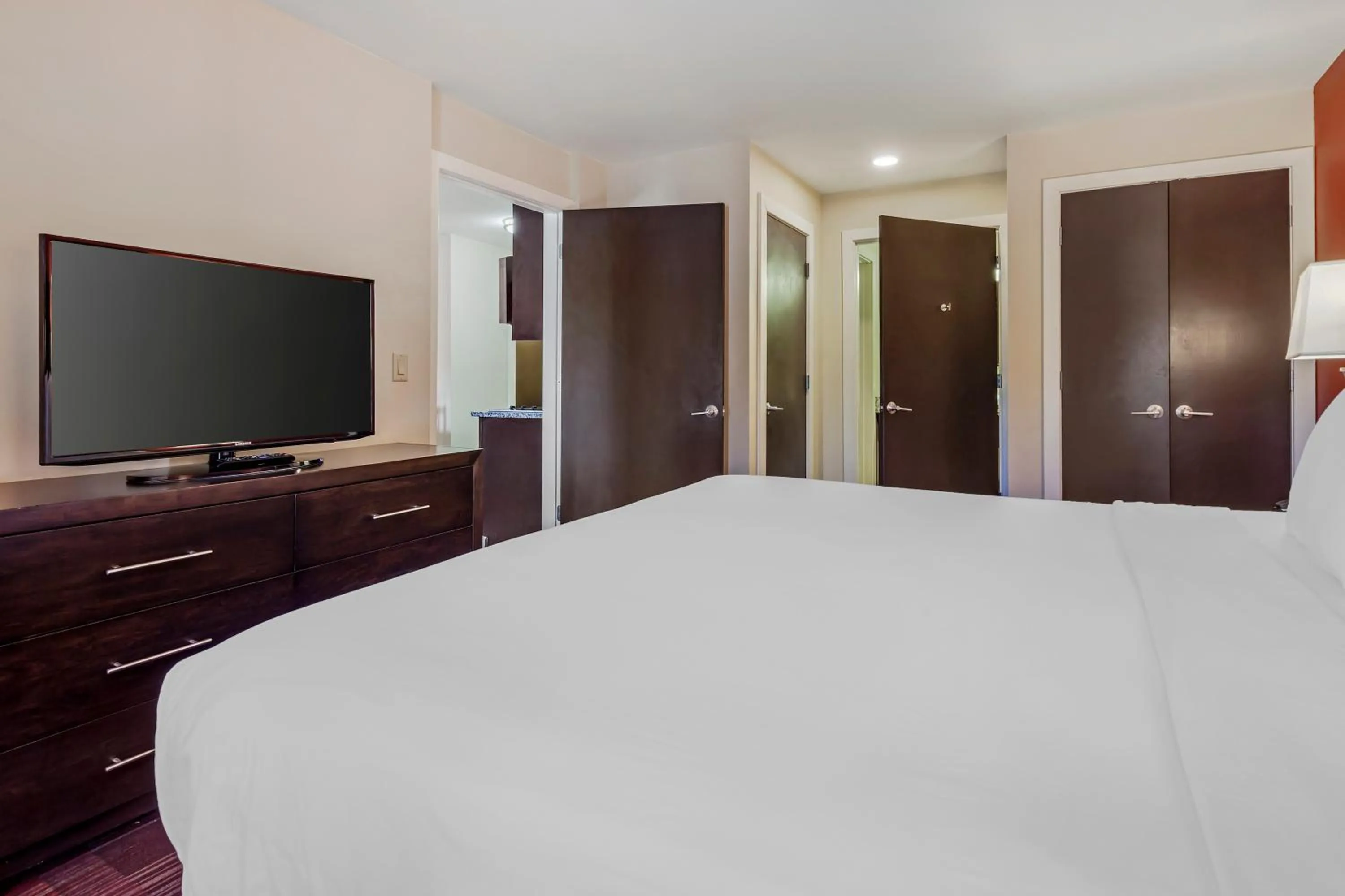 Bedroom in Polynesian Hotel & Suites