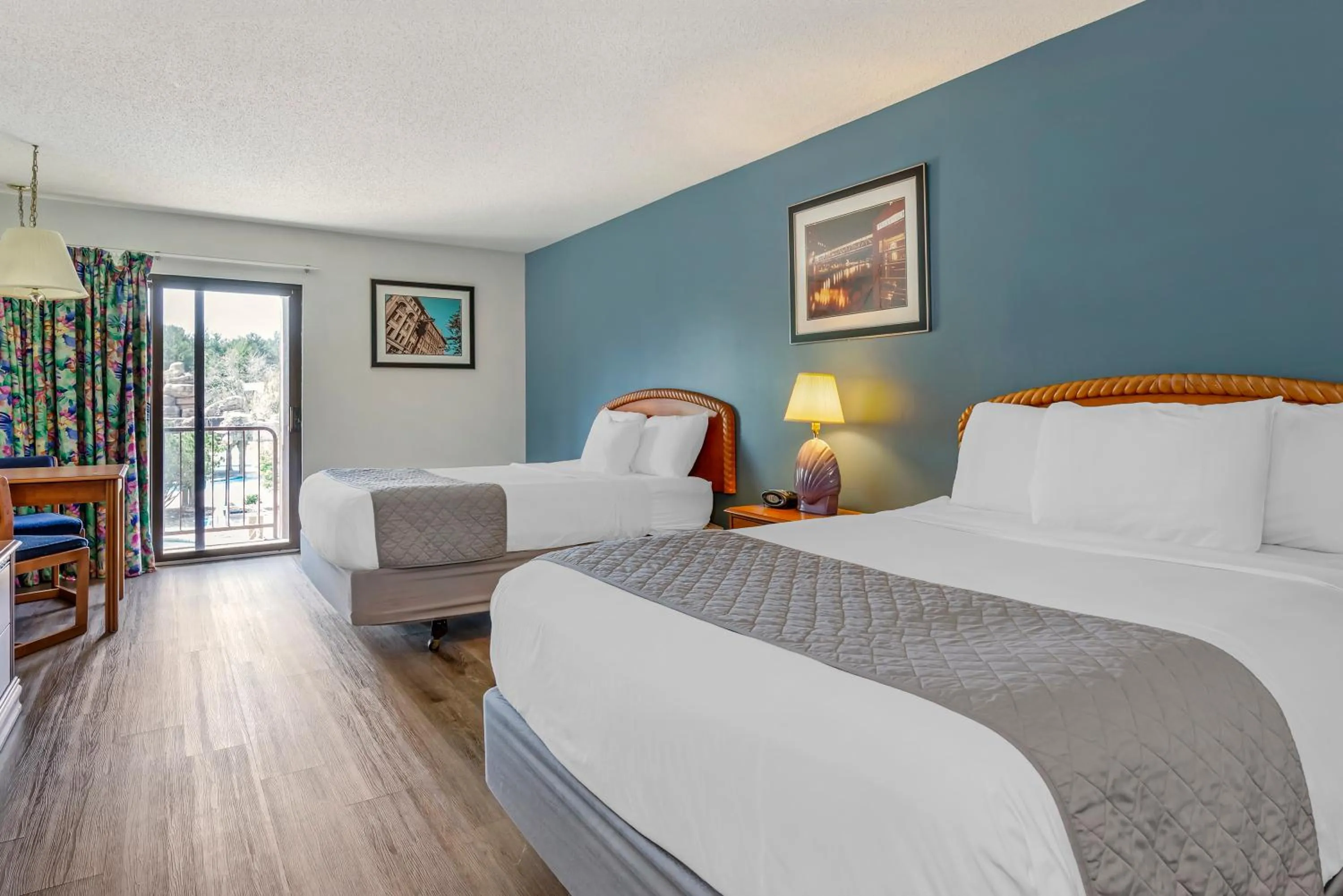 Bed in Polynesian Hotel & Suites