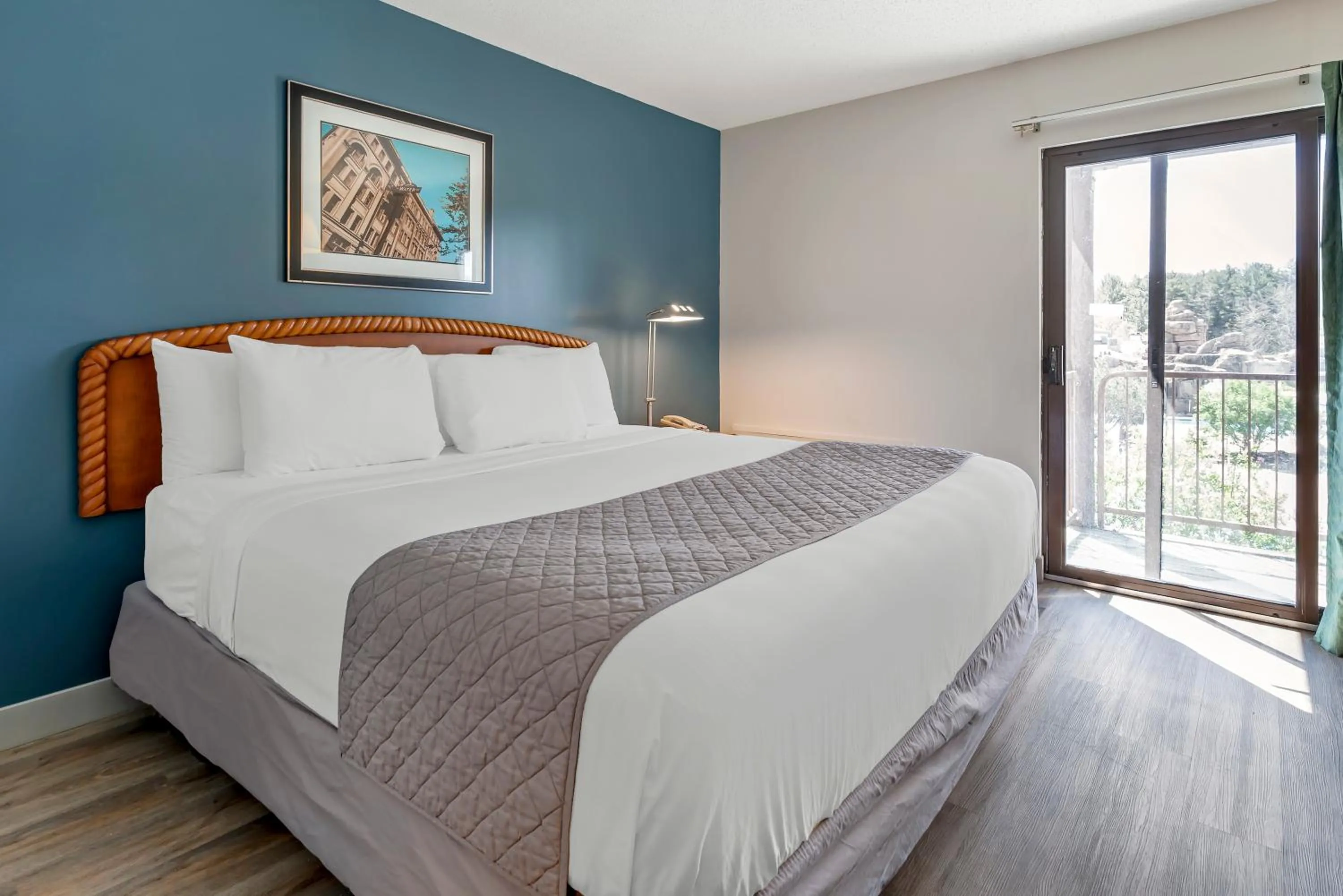 Bed in Polynesian Hotel & Suites