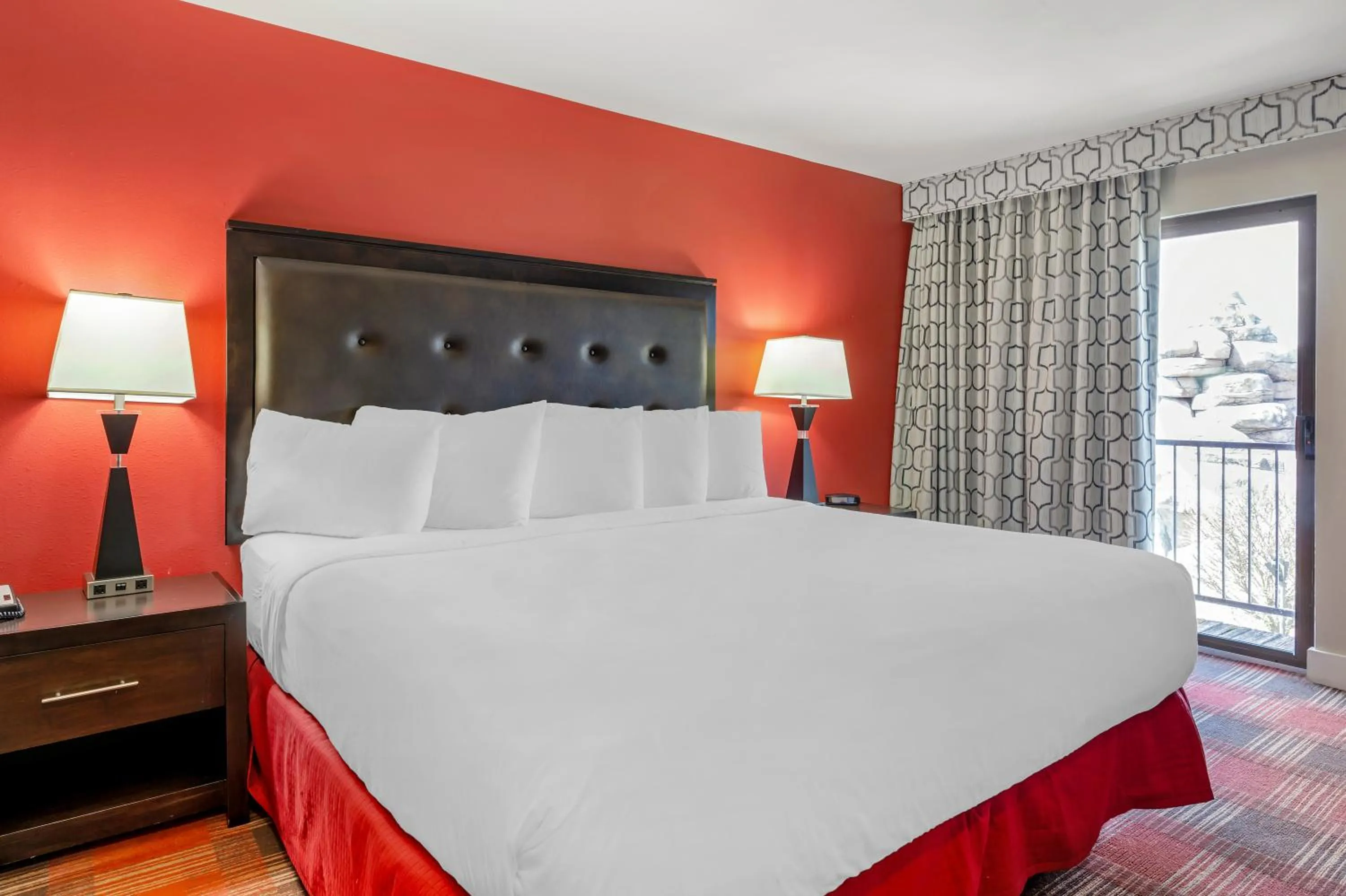 Bed in Polynesian Hotel & Suites